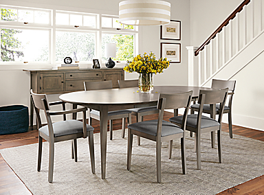 Dining room with Adams extension table in shell finish with Doyle arm and side chairs with Canvas Slate seat fabric and shell finish.