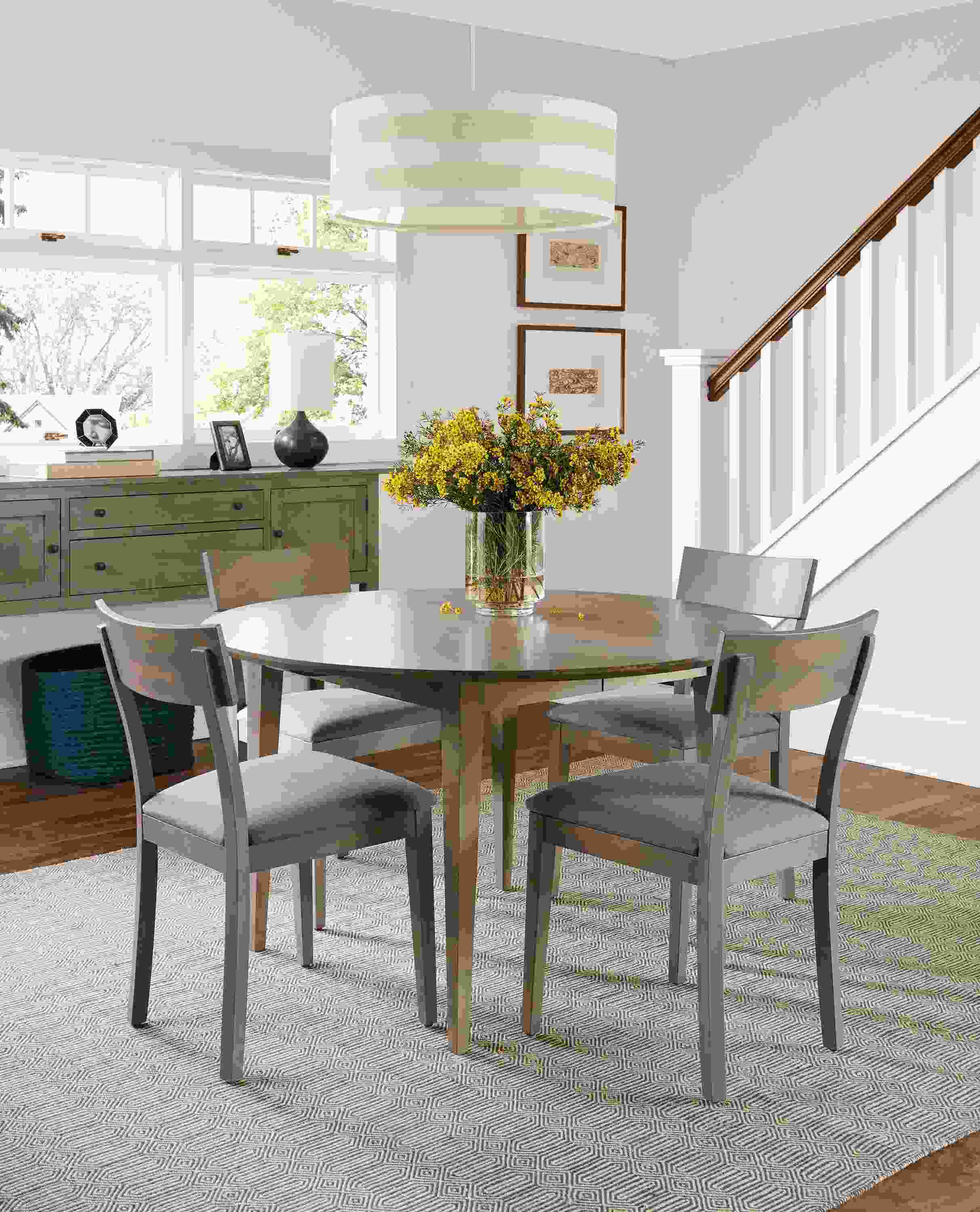 Dining room with Adams 48-diameter extension table and Adams storage cabined in shell.
