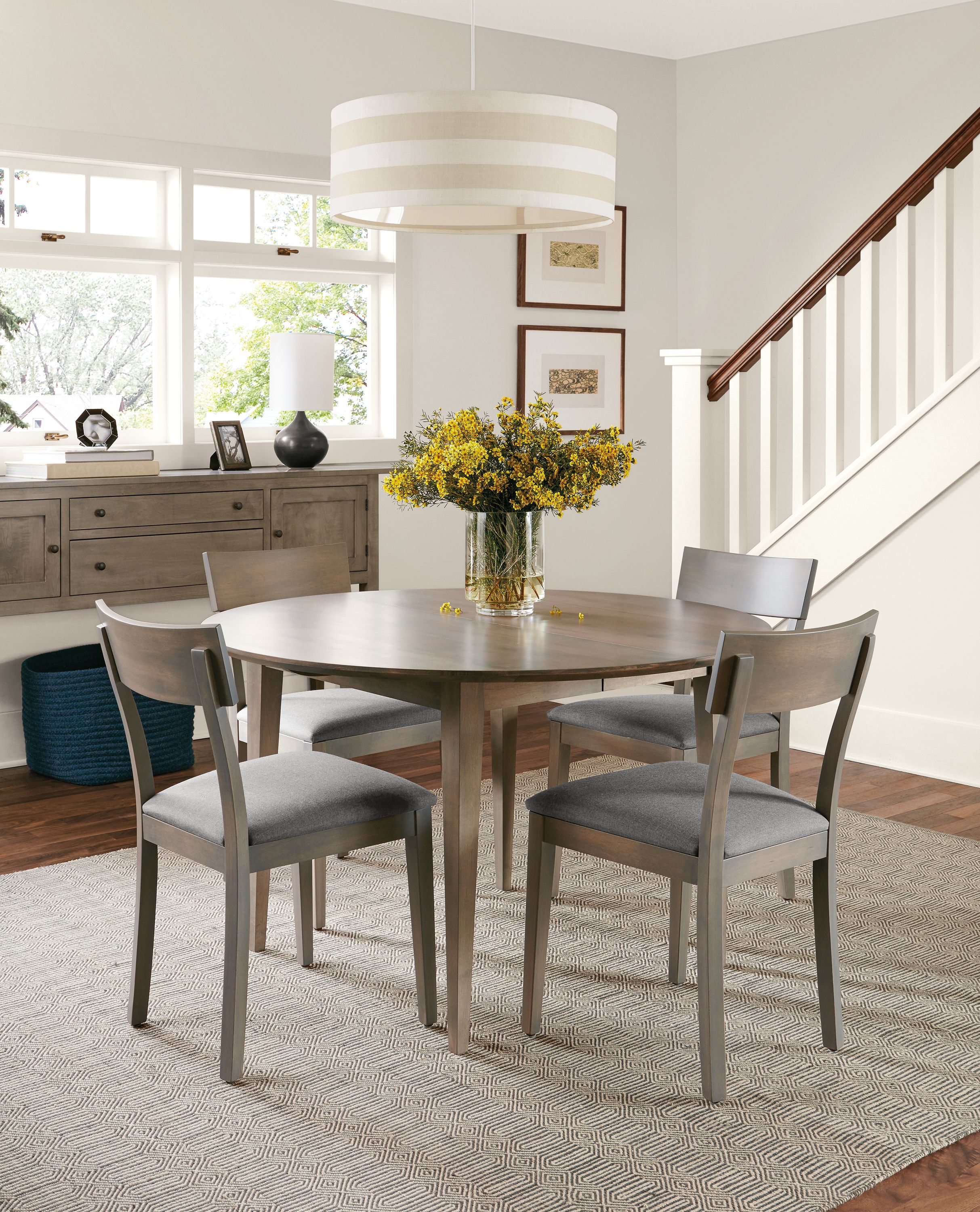 Dining room with Adams 48-diameter extension table and Adams storage cabined in shell.