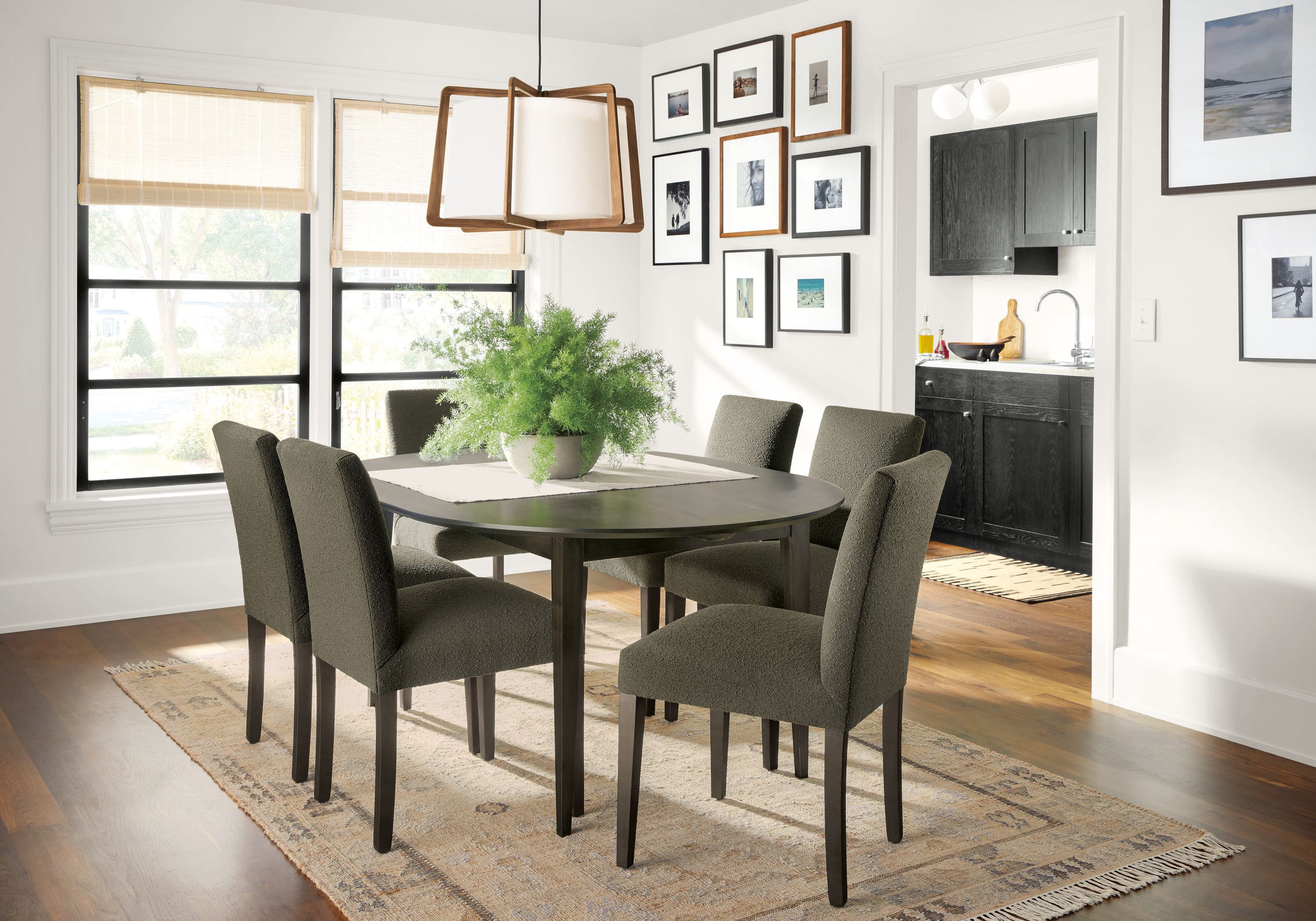 Dining room with Adams round extension table, Peyton chairs and Villa rug.