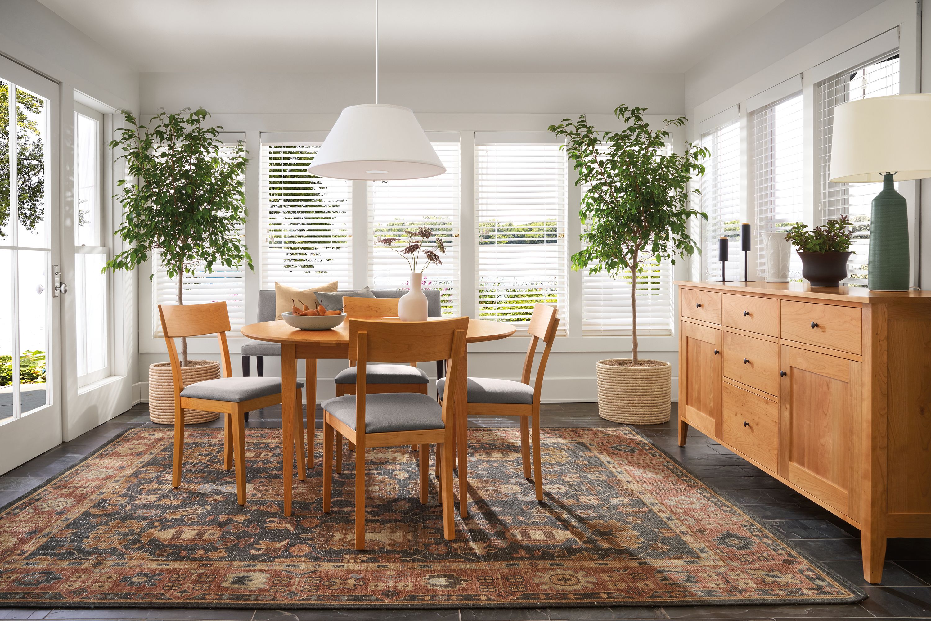 dining room with adams round extension table (not extended), doyle chairs, tillia rug.