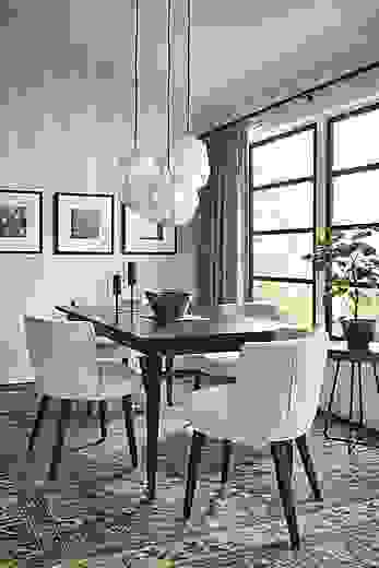 Dining room with Adams extension table, June side chairs, Orikata pendants, blue kayseri rug.