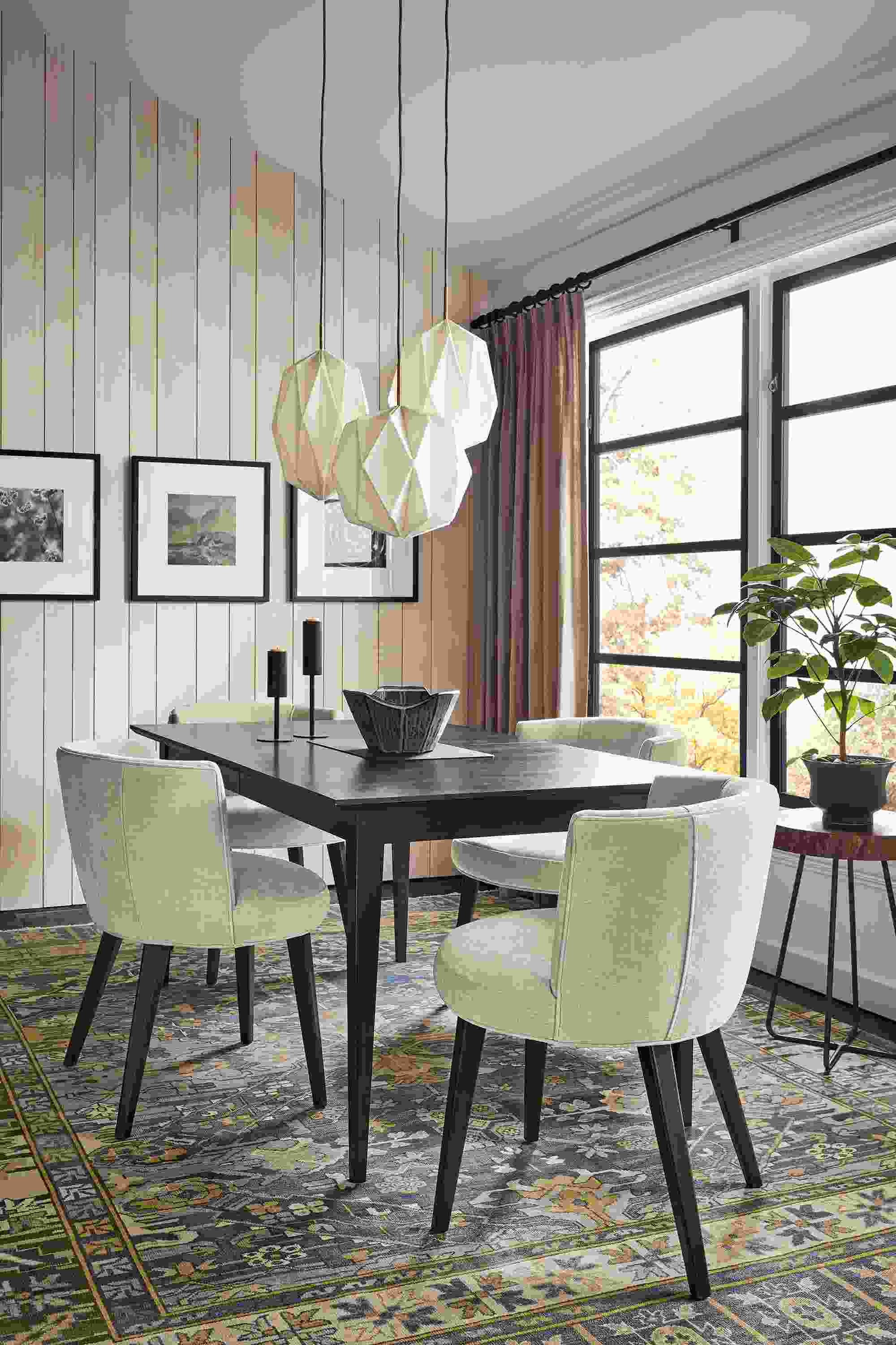 Dining room with Adams extension table in charcoal, June side chairs in Mori Oatmeal, Orikata pendants, marine Kayseri rug.