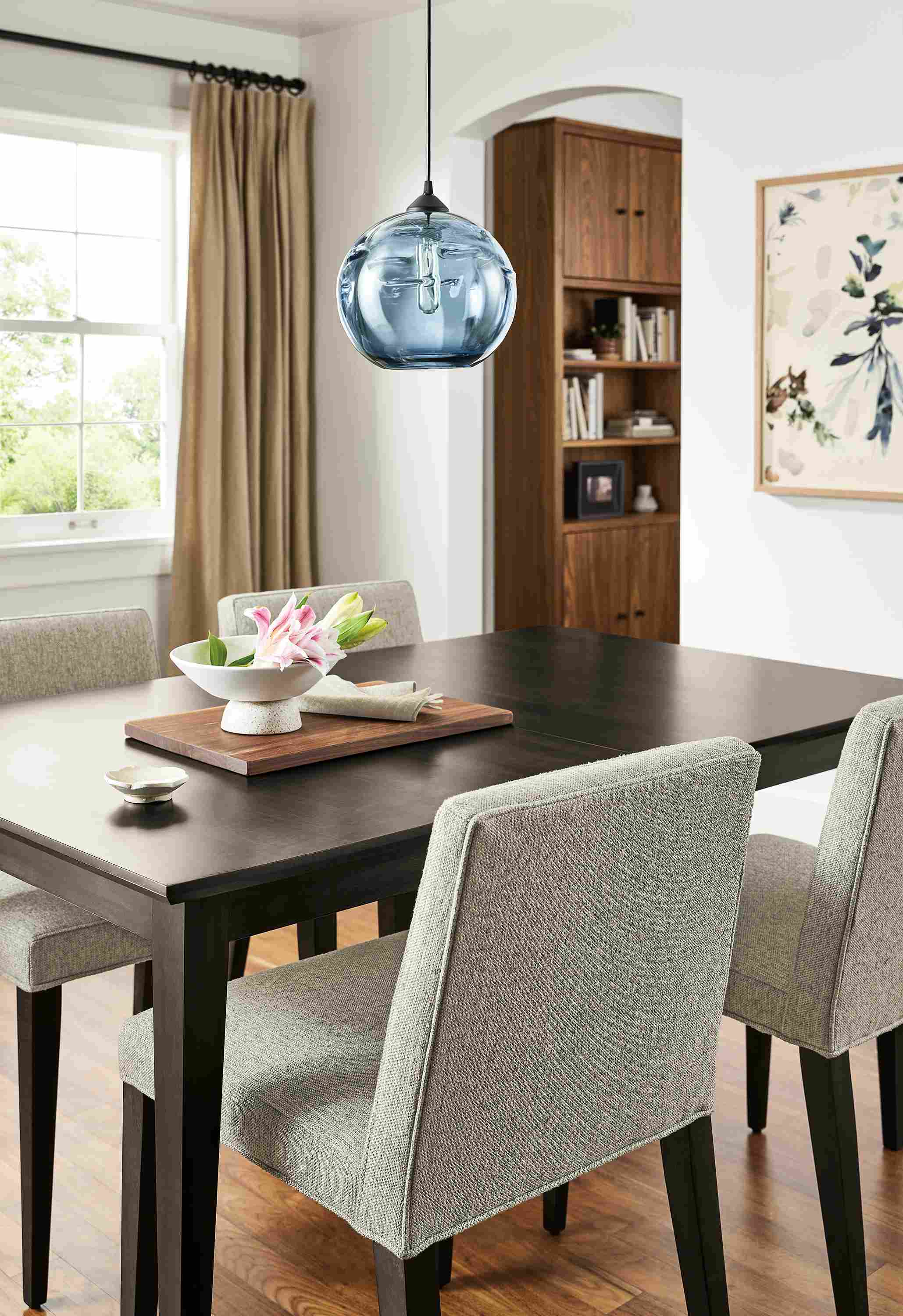 Dining room with Adams extension table in charcoal and 4 Ava side chairs in Conley Cloud upholstery with charcoal legs.