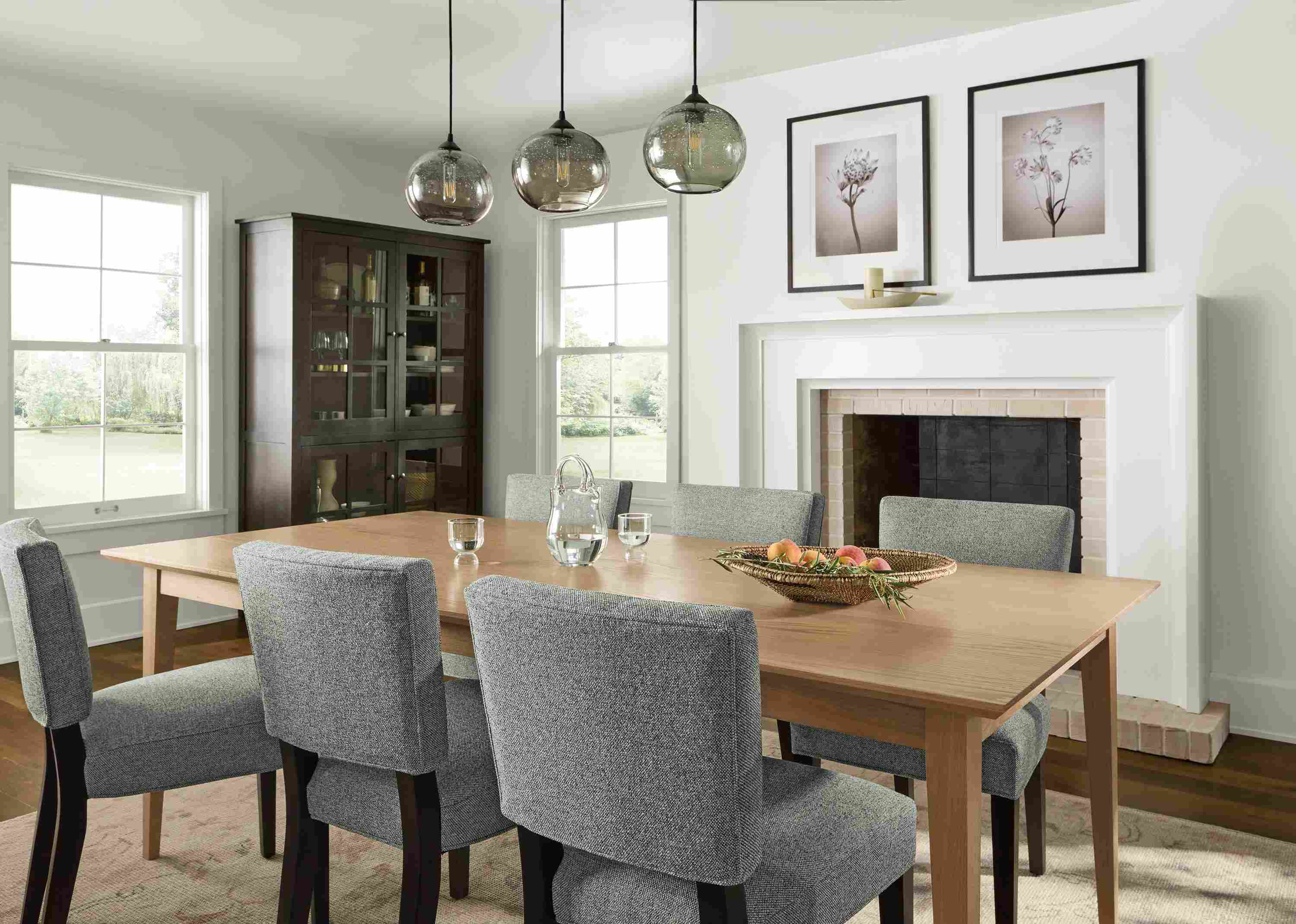 Dining room with Adams 84-wide table in rye on red oak, and 6 Georgia side chairs in tatum slate with charcoal legs.