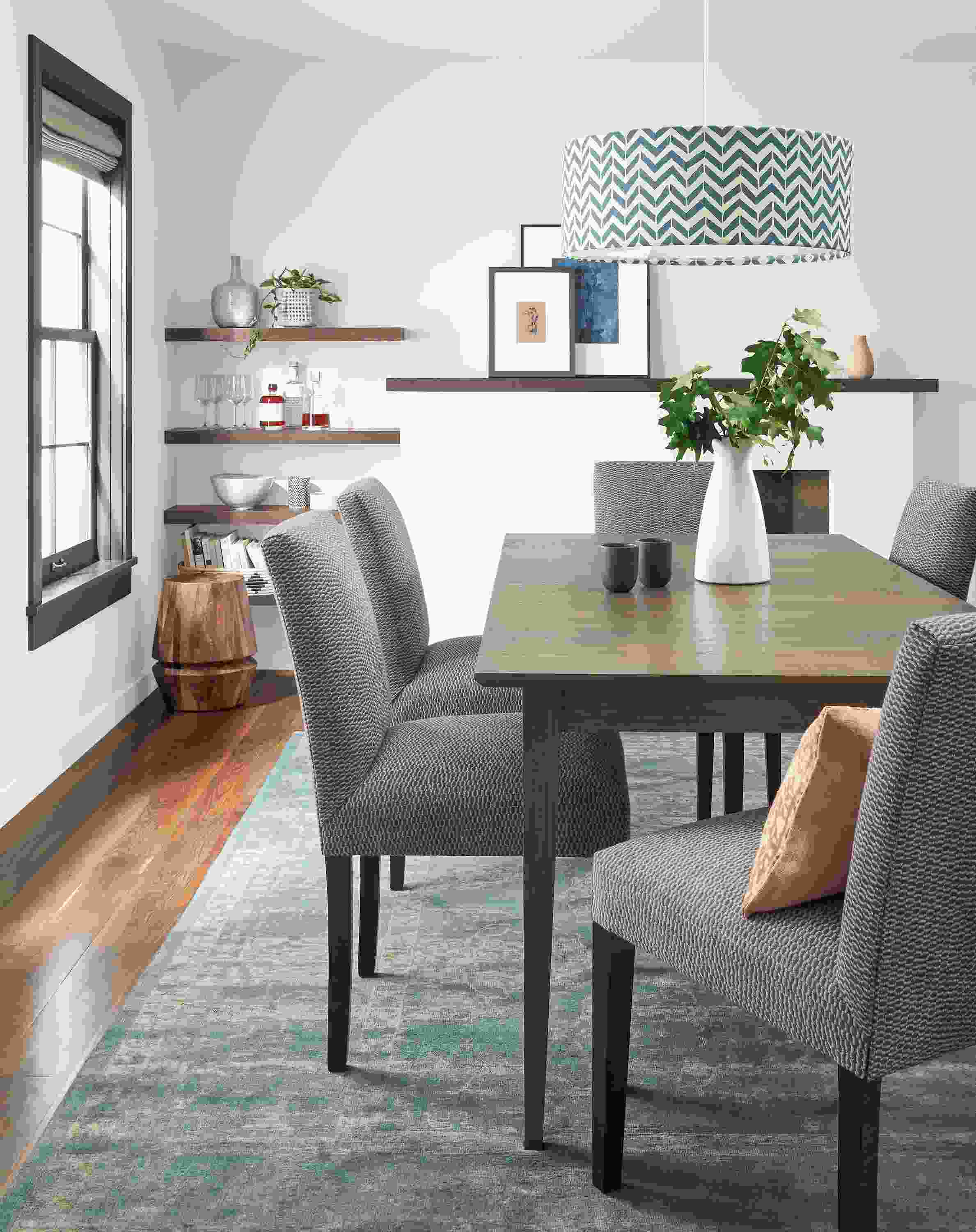 Dining room with Adams 72-wide extension table in bark and 5 Peyton side chairs in Keel Graphite.