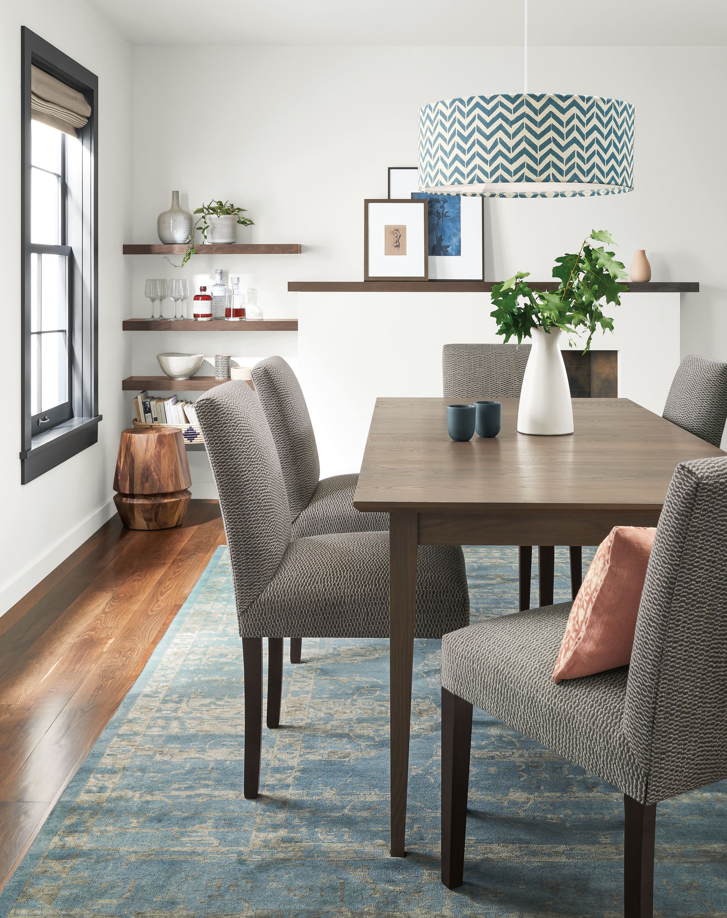 Dining room with Adams 72-wide extension table in bark and 5 Peyton side chairs in Keel Graphite.
