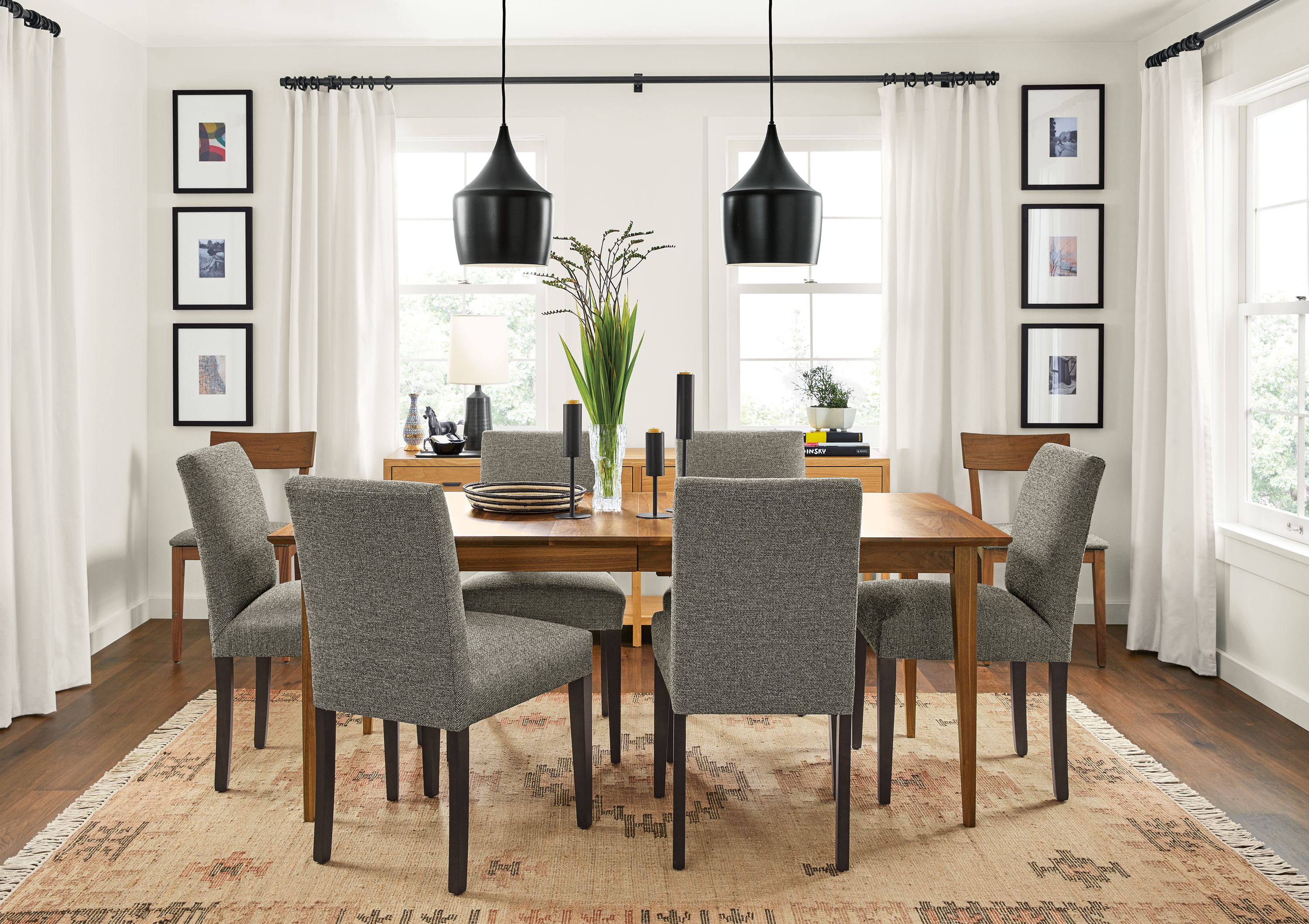 Detail of Adams extension table with Peyton chairs in Tatum Salt fabric in living room.