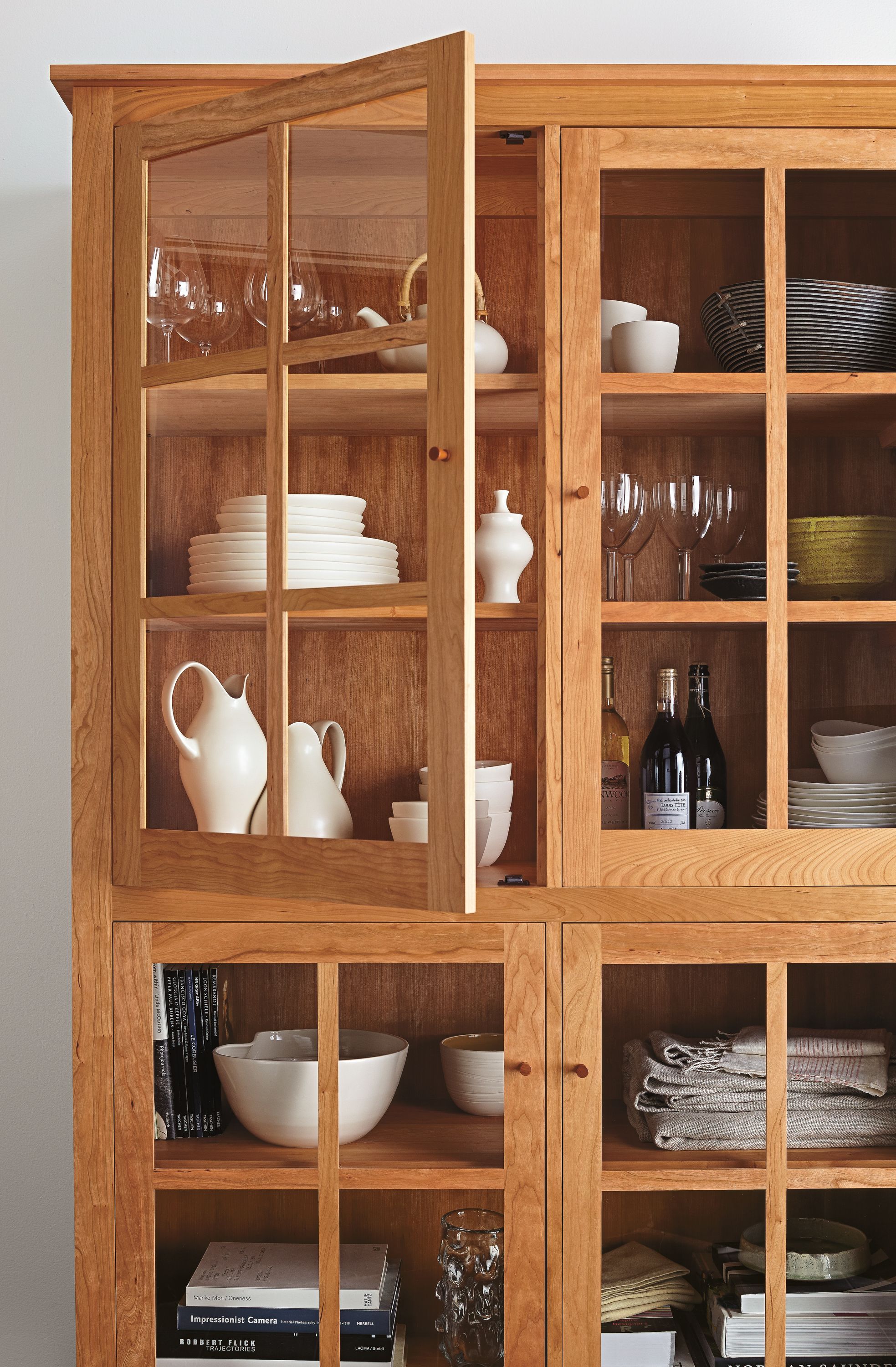 Detail of Adams 50-wide glass door storage cabinet in Cherry.