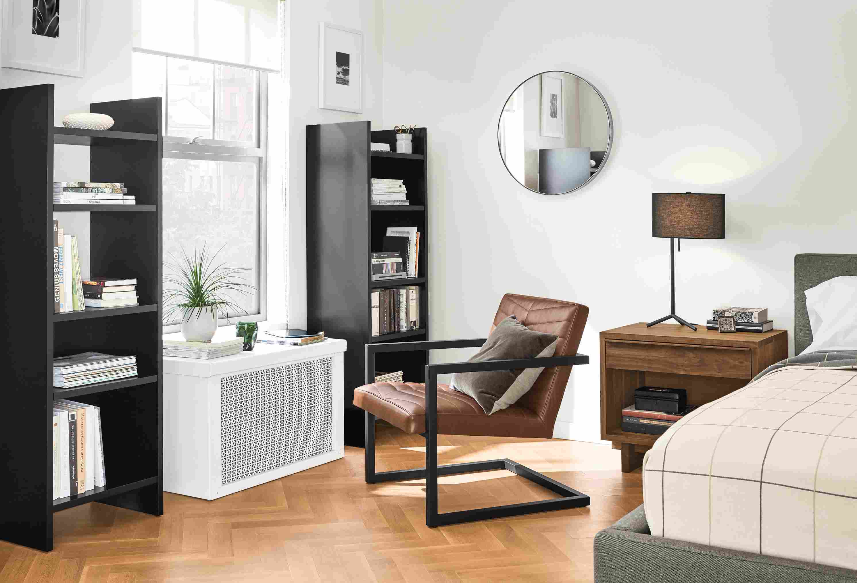 Two custom Addison bookcases in small bedroom.