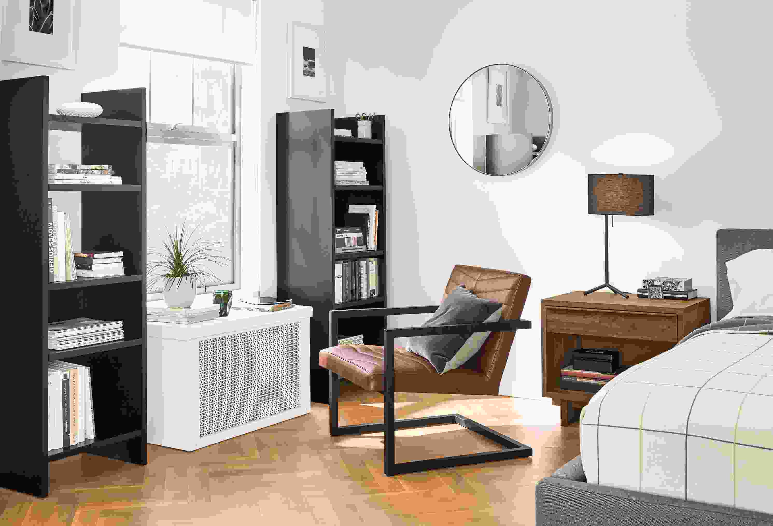 Two custom Addison bookcases in small bedroom.