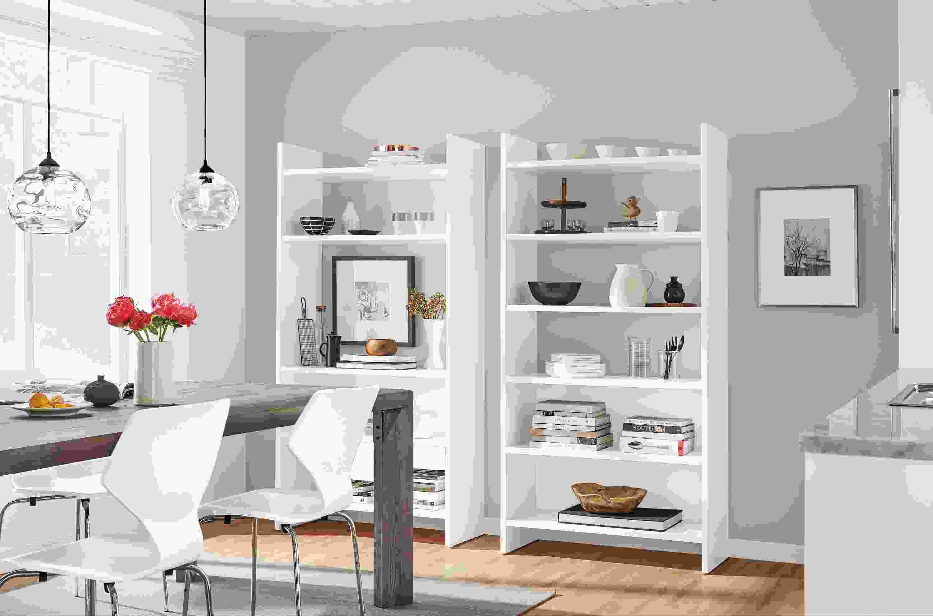 Custom white Addison bookcases in dining room.