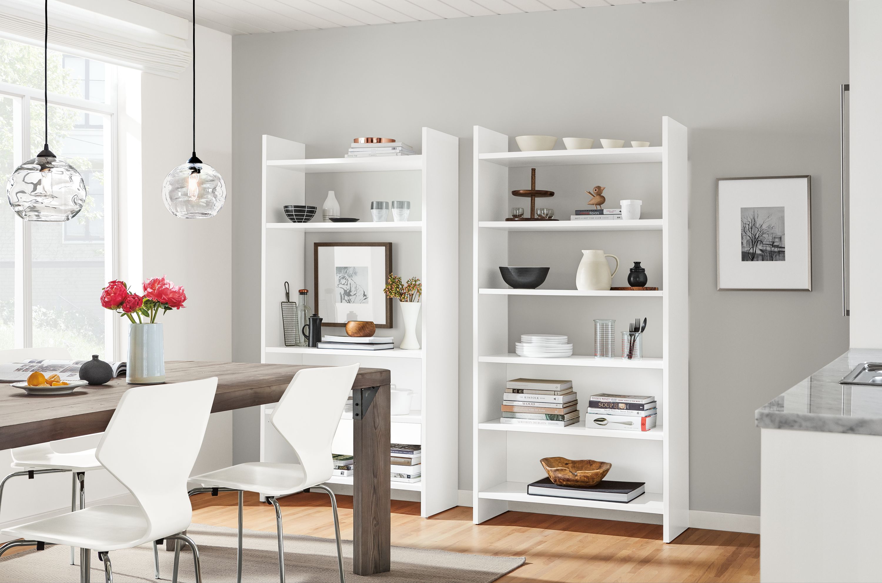 Custom white Addison bookcases in dining room.