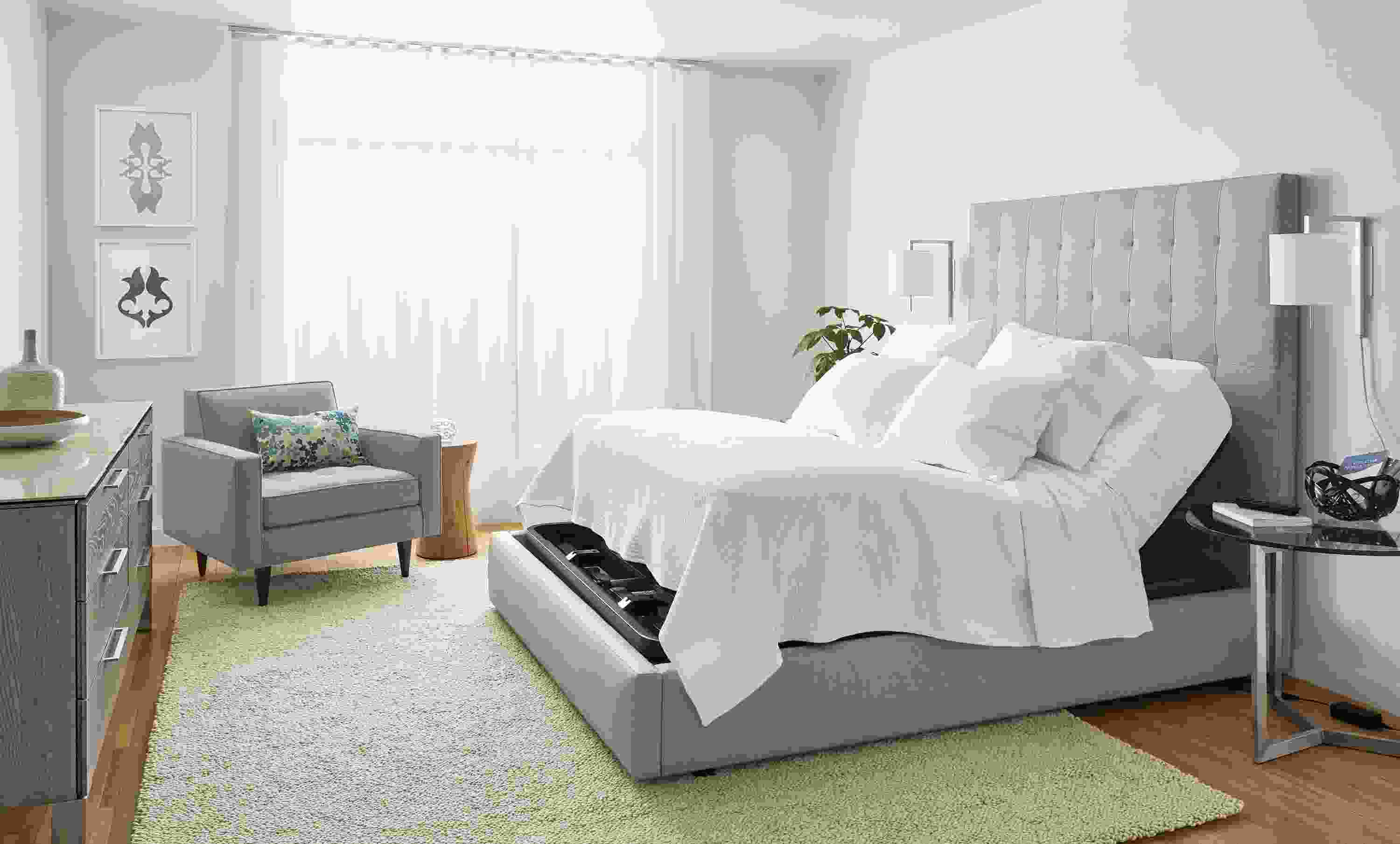 Bedroom with Room & Board queen deluxe adjustable mattress base and Whitmore coverlet in white.