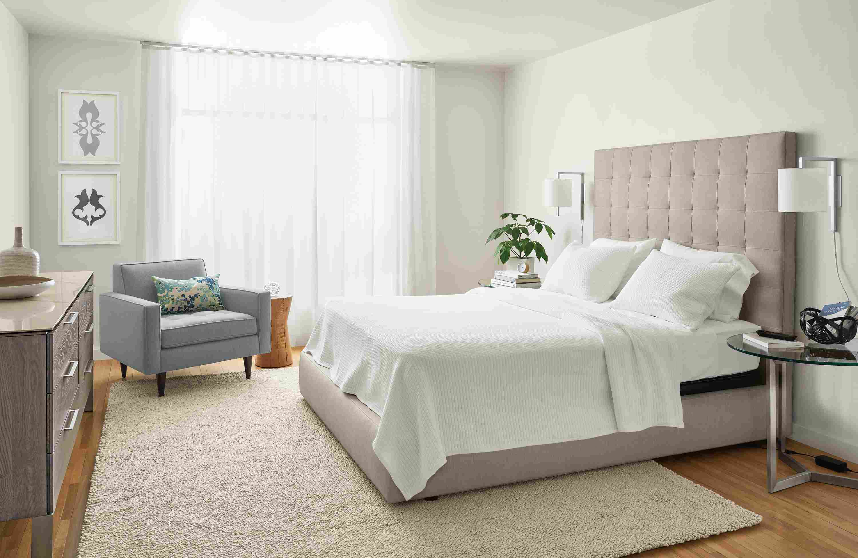 Large bedroom with detail of Room & Board queen deluxe adjustable mattress base with Whitmore matelasse coverlet.