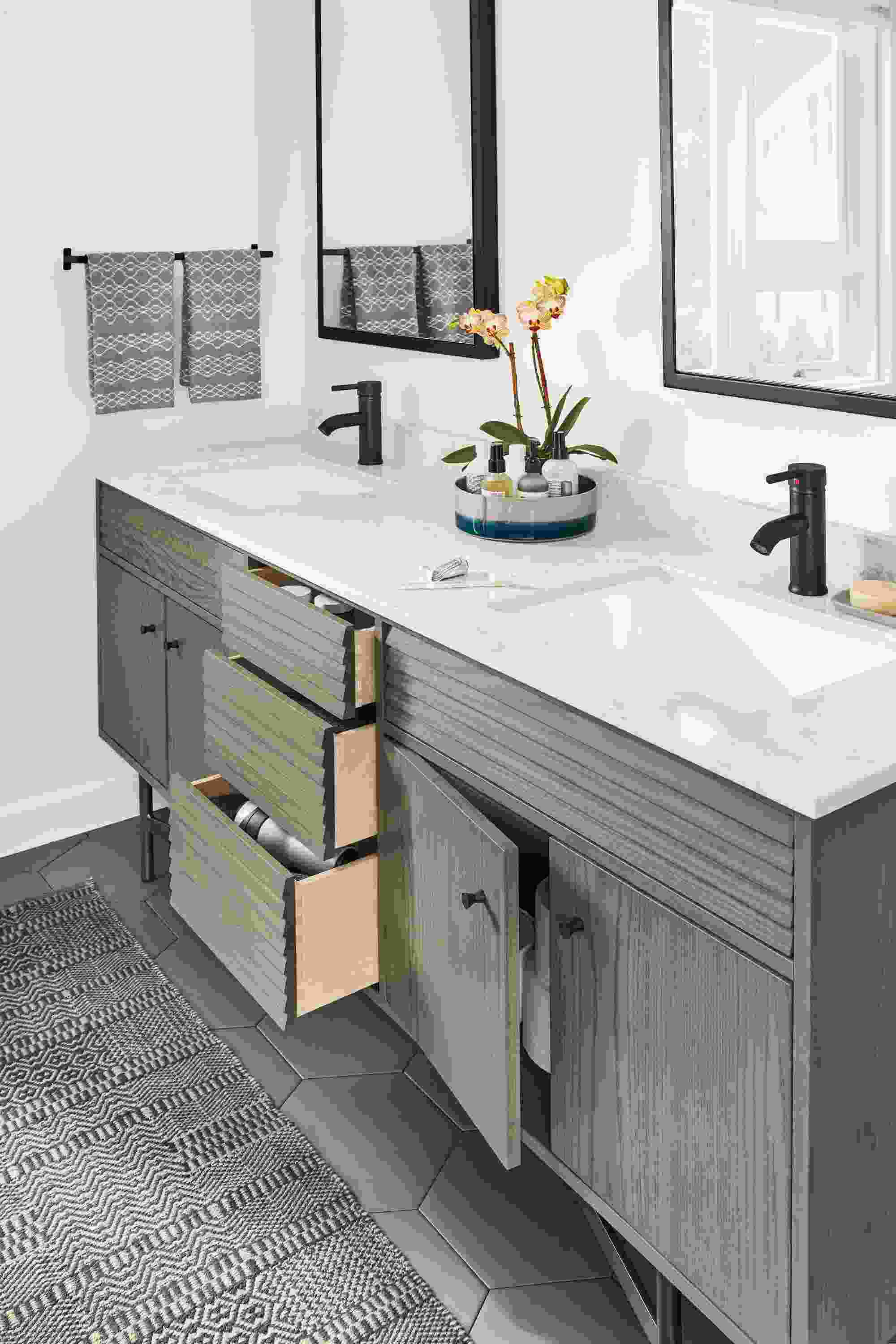 Bathroom with detail of Adrian bath vanity cabinet shown with  drawers partially open.