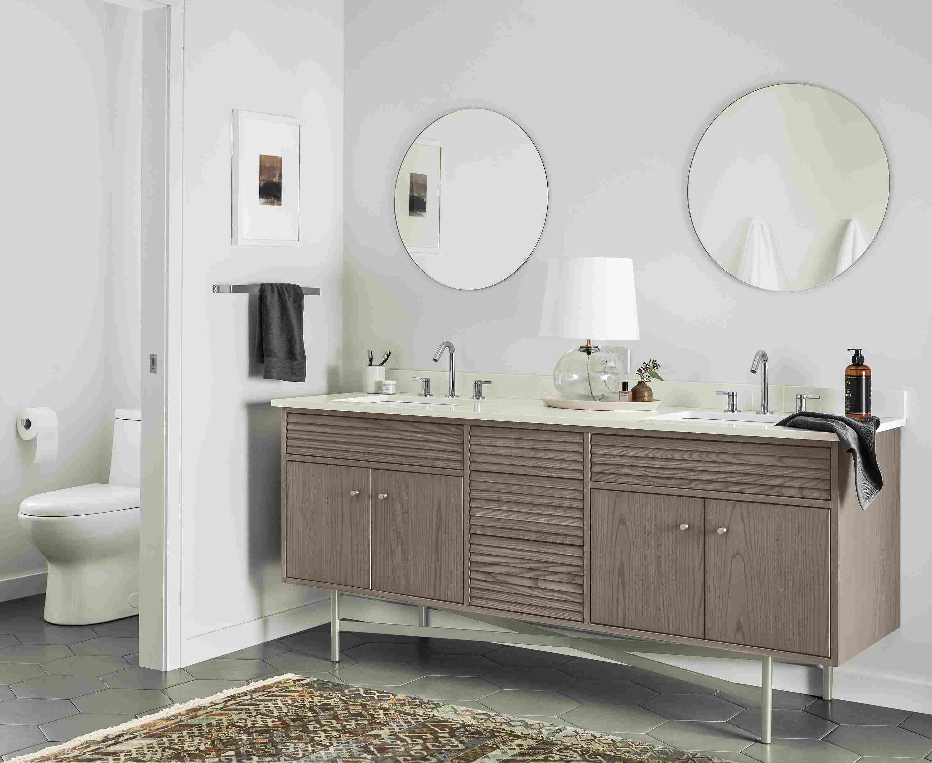 Bathroom with Adrian 72-wide vanity in shell on ash with white quartz top and 2 Focus 24-diameter mirrors in clear glass.