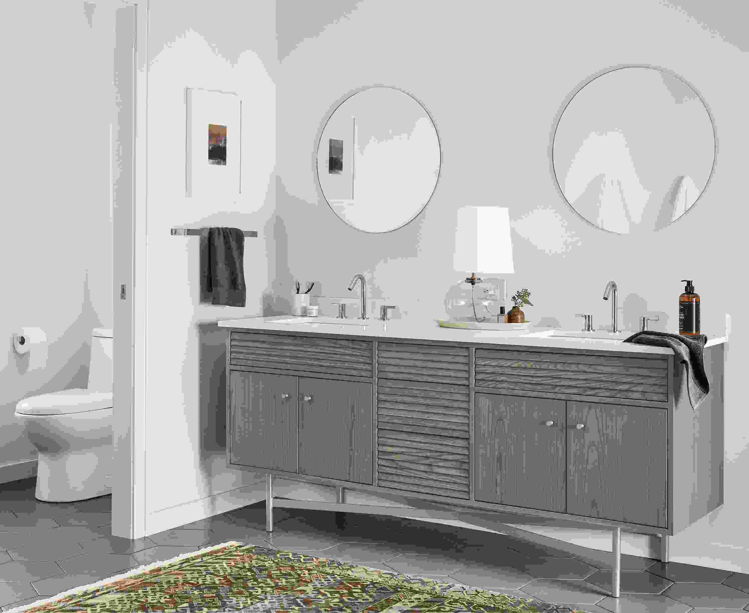Bathroom with Adrian 72-wide vanity in shell on ash with white quartz top and 2 Focus 24-diameter mirrors in clear glass.