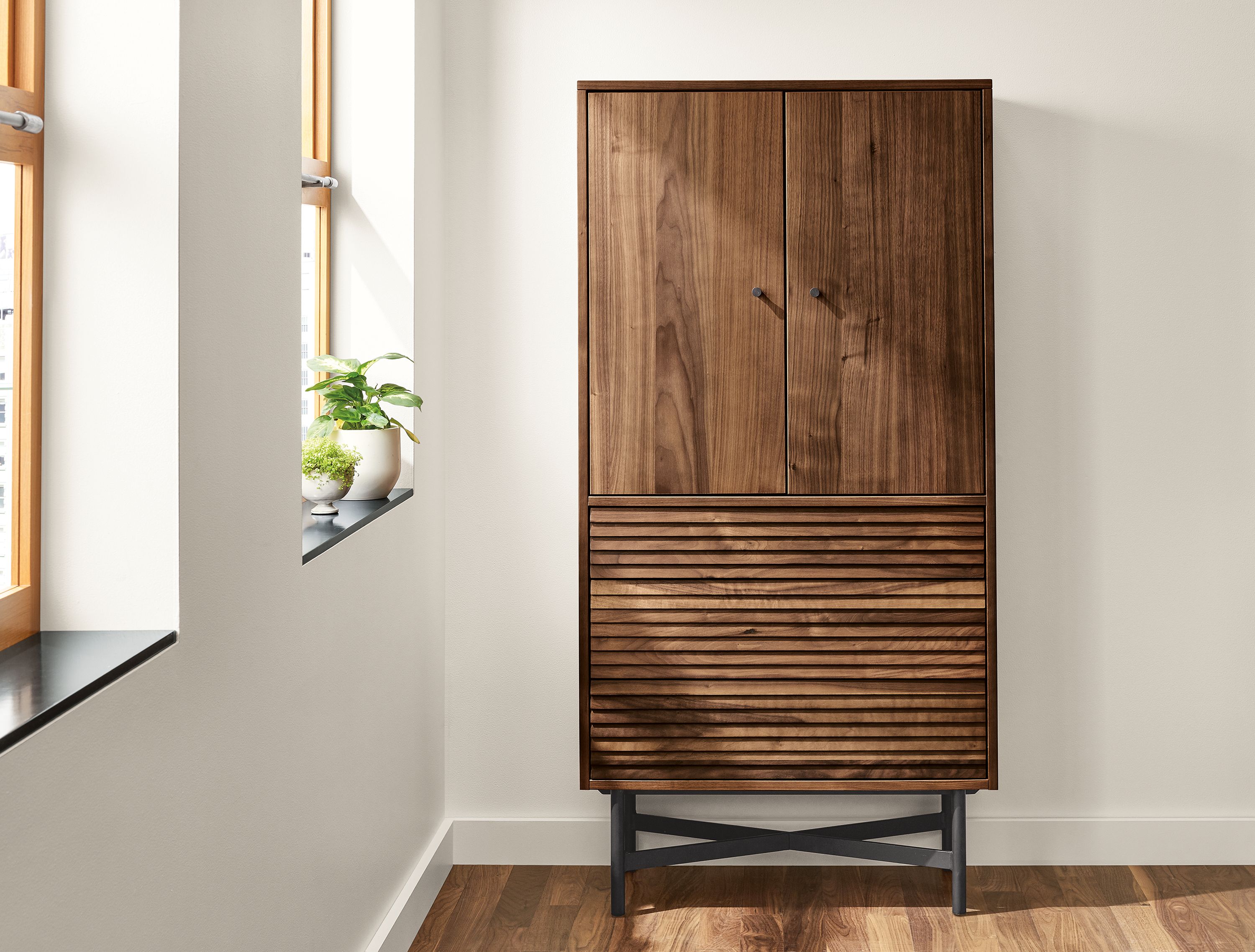 Detail of Adrian 30-wide storage cabinet in walnut.