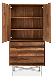 Detail of large Adrian storage cabinet with doors open.