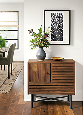Detail of Adrian storage cabinet in walnut as small entryway console table.