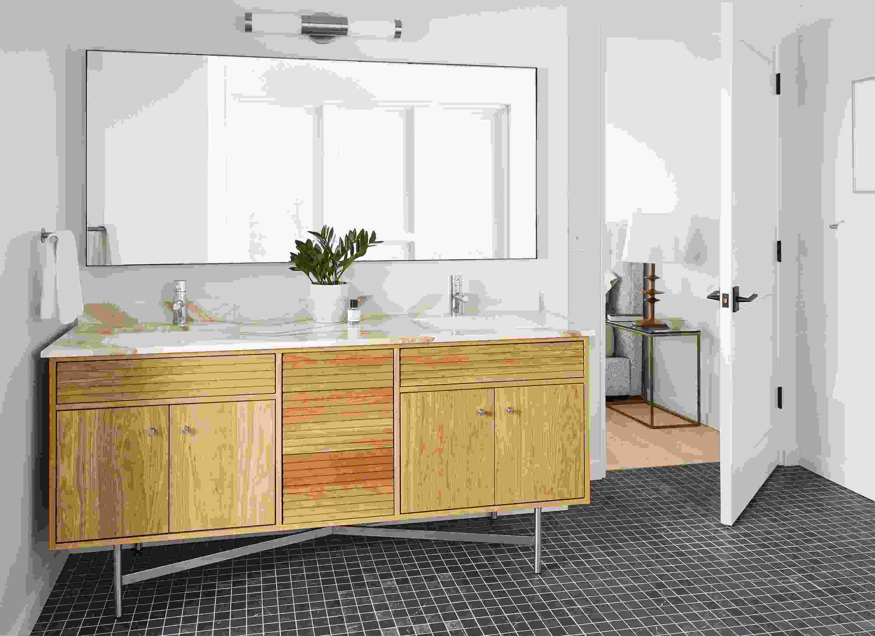 Large bathroom with Adrian 72-wide vanity in white oak with Brittanicca Gold Warm top and stainless steel base.