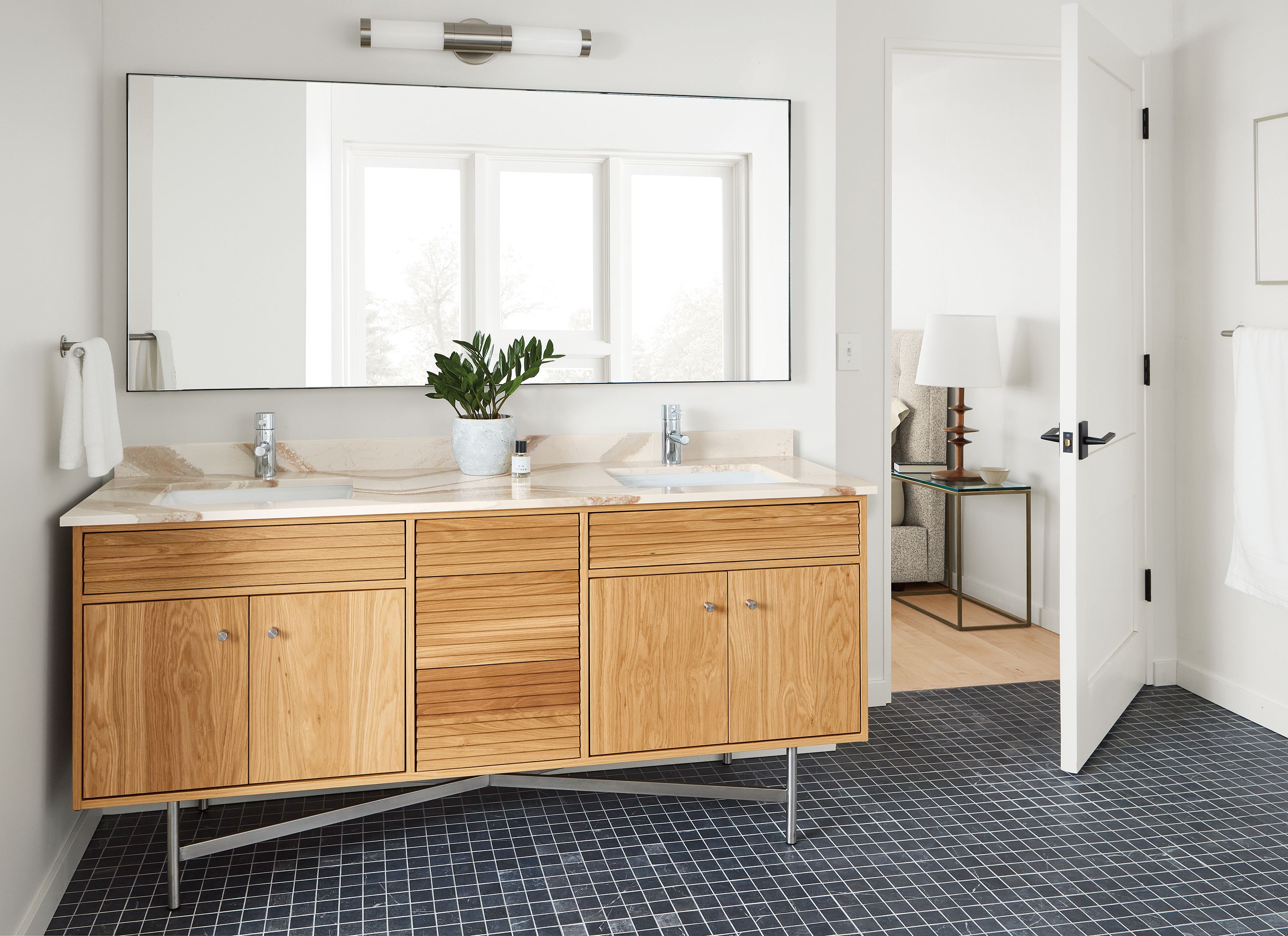 Room setting with Adrian vanity in white oak and Cambria top.