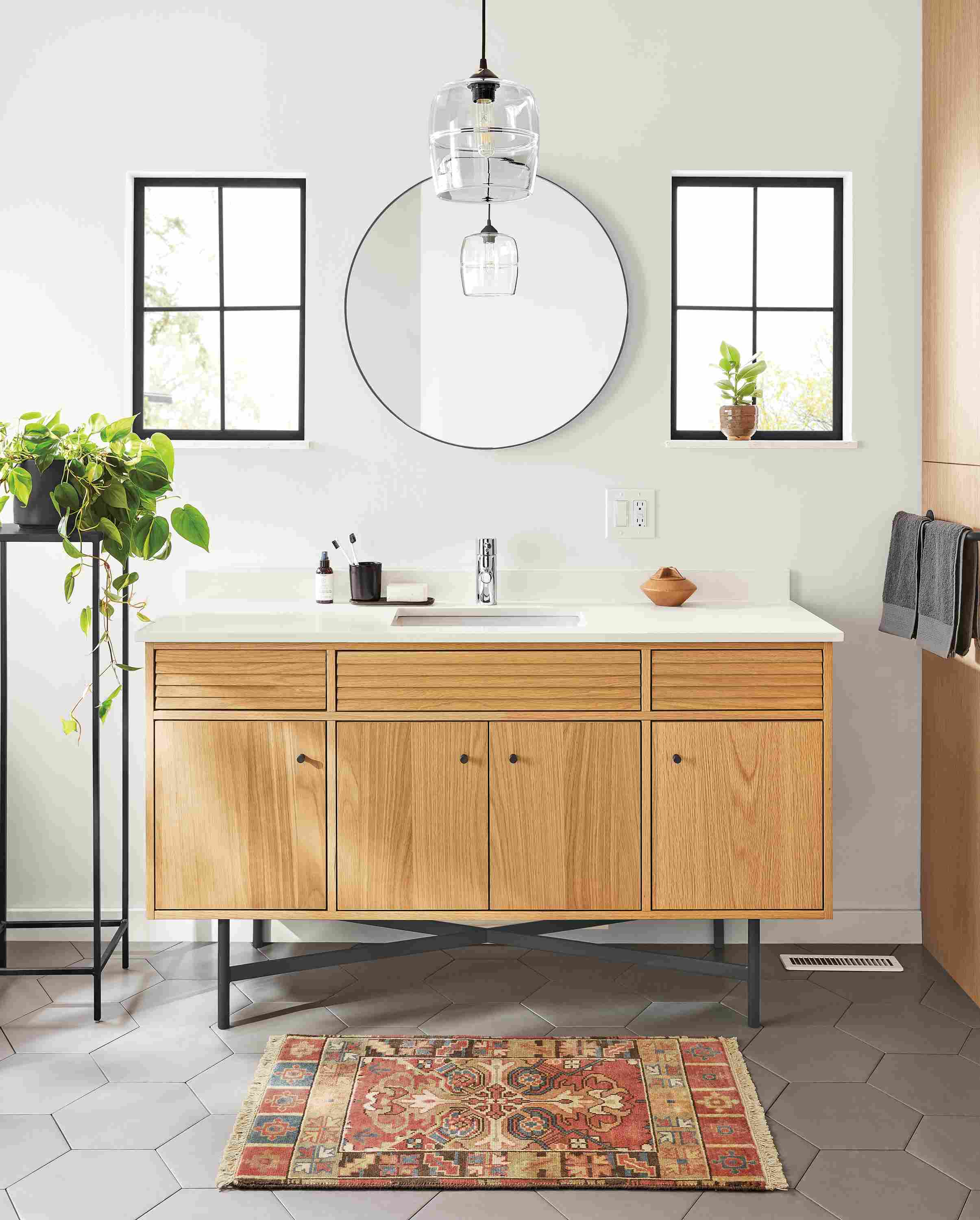 Bathroom with Adrian 60-wide vanity in white oak with white quartz top and graphite base.