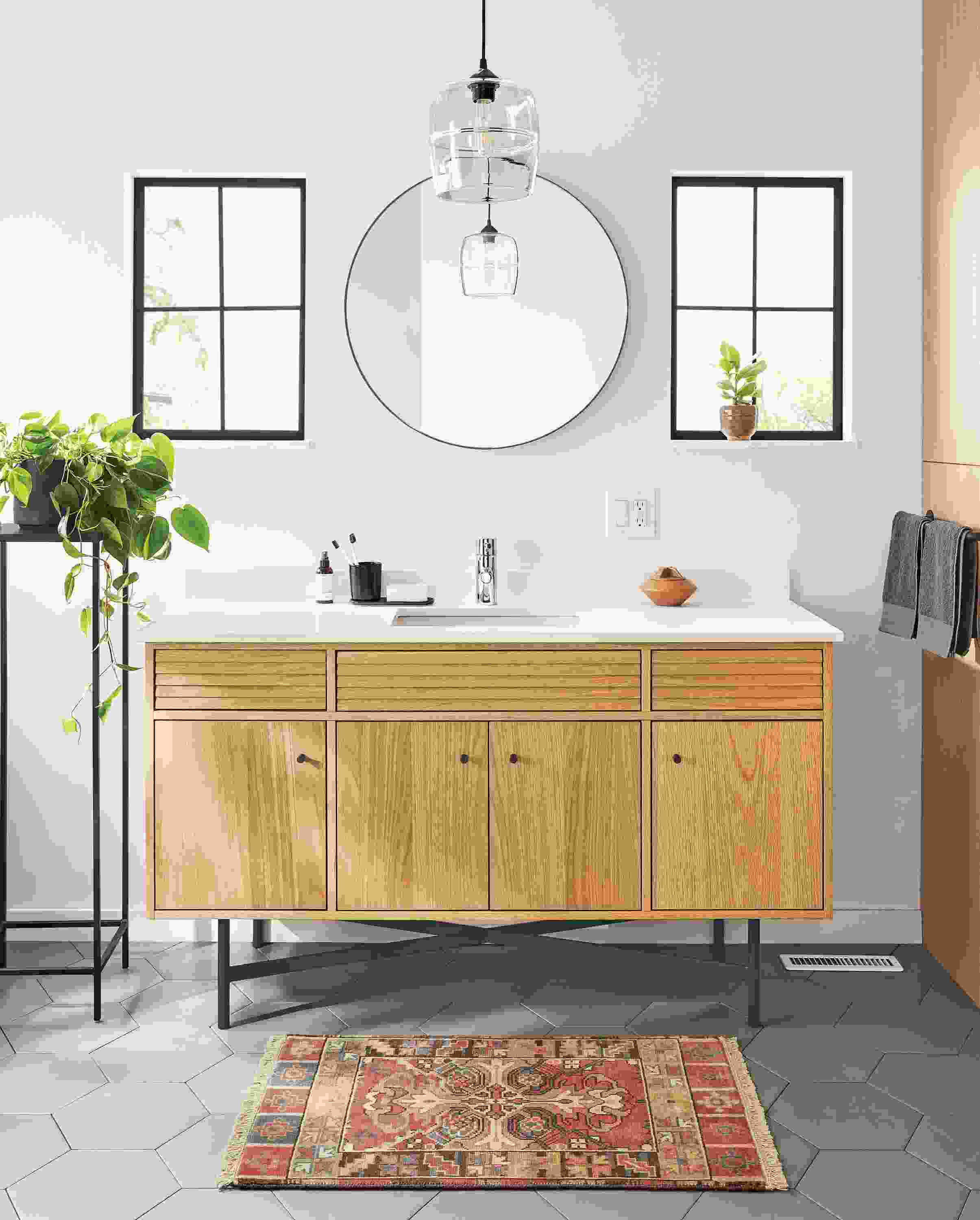 Bathroom with Adrian 60-wide vanity in white oak with white quartz top and graphite base.