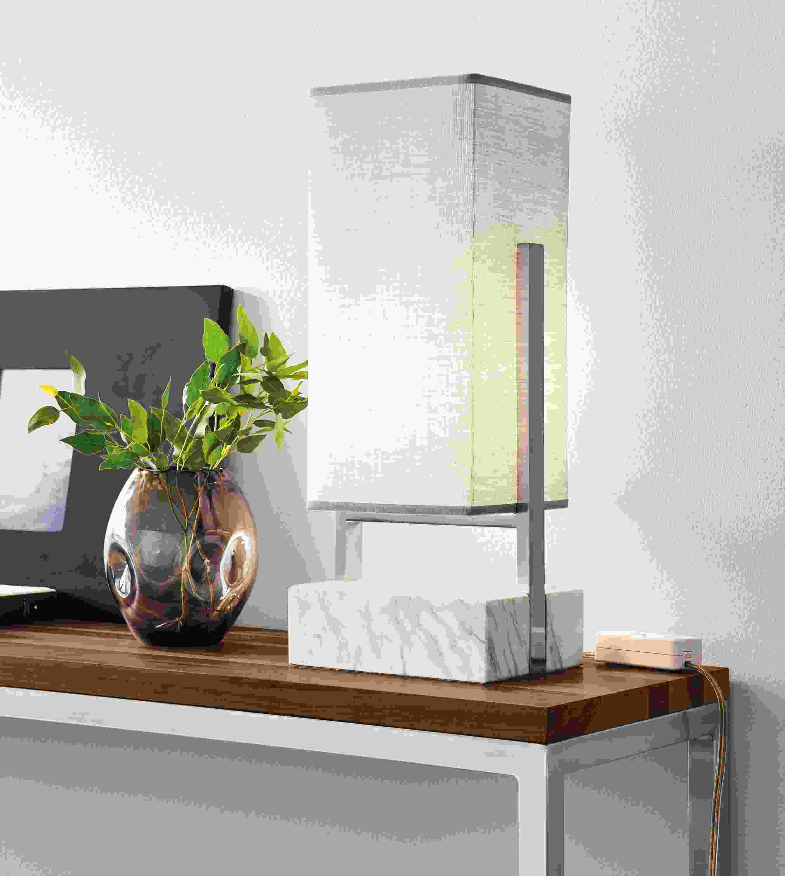 Detail of Adwell table lamp in marble on a Portica console table in stainless with walnut top.