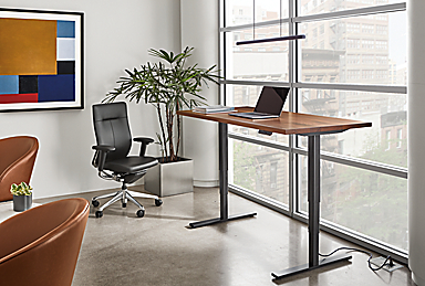 Aedric 60-wide Adjustable Standing Desk in standing position with Choral Office Chair in Black Leather.