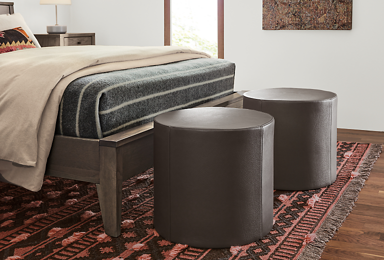 Detail of Aero leather ottomans at end of bed.