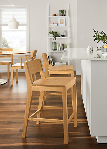 Side view of Afton counter stool in white oak.