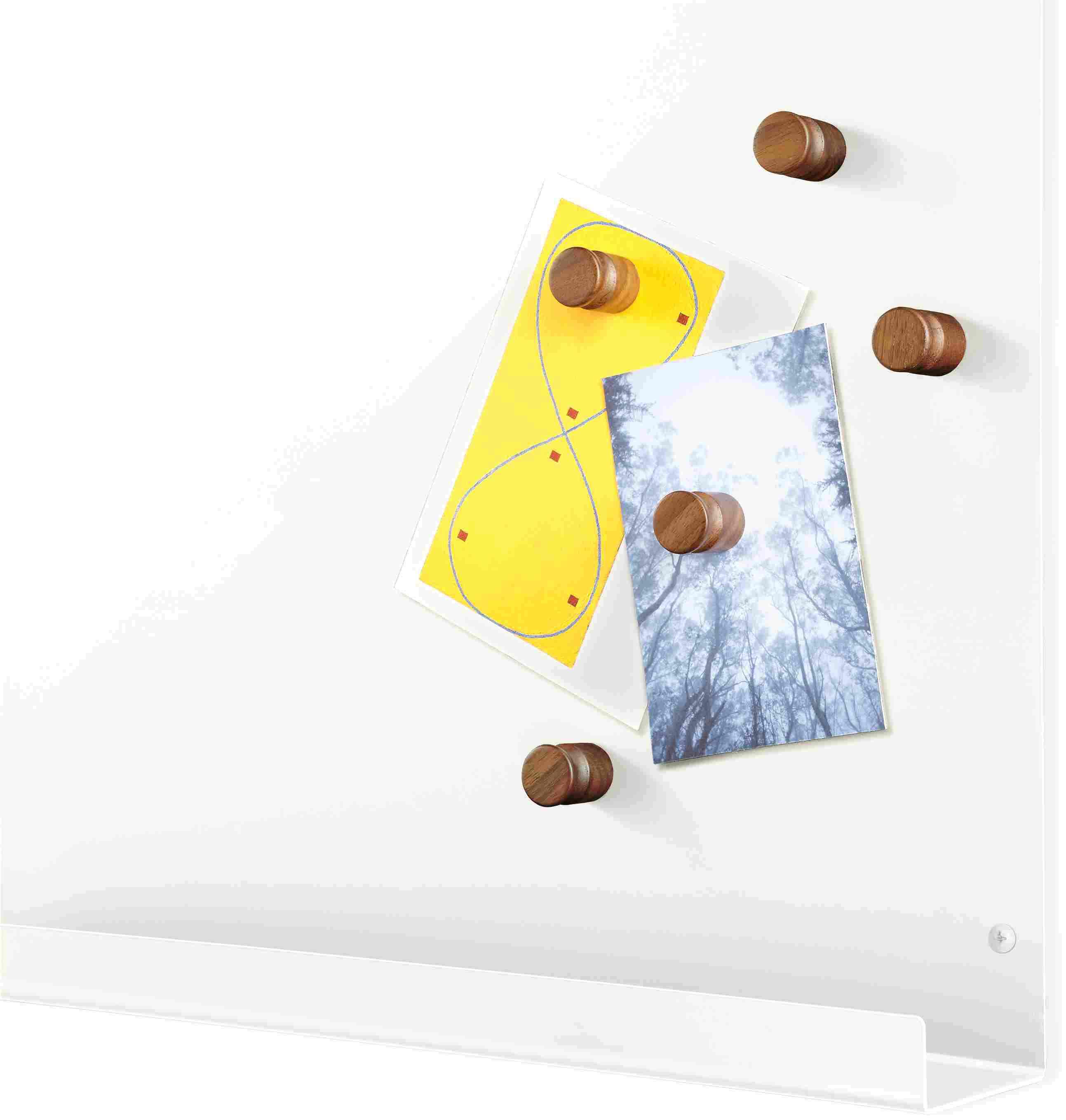 Corner detail of Agenda magnet board in white.