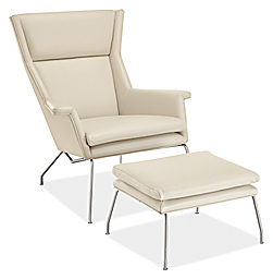 Angle  view of Aidan Chair and Ottoman in Urbino Leather with Stainless Steel base.