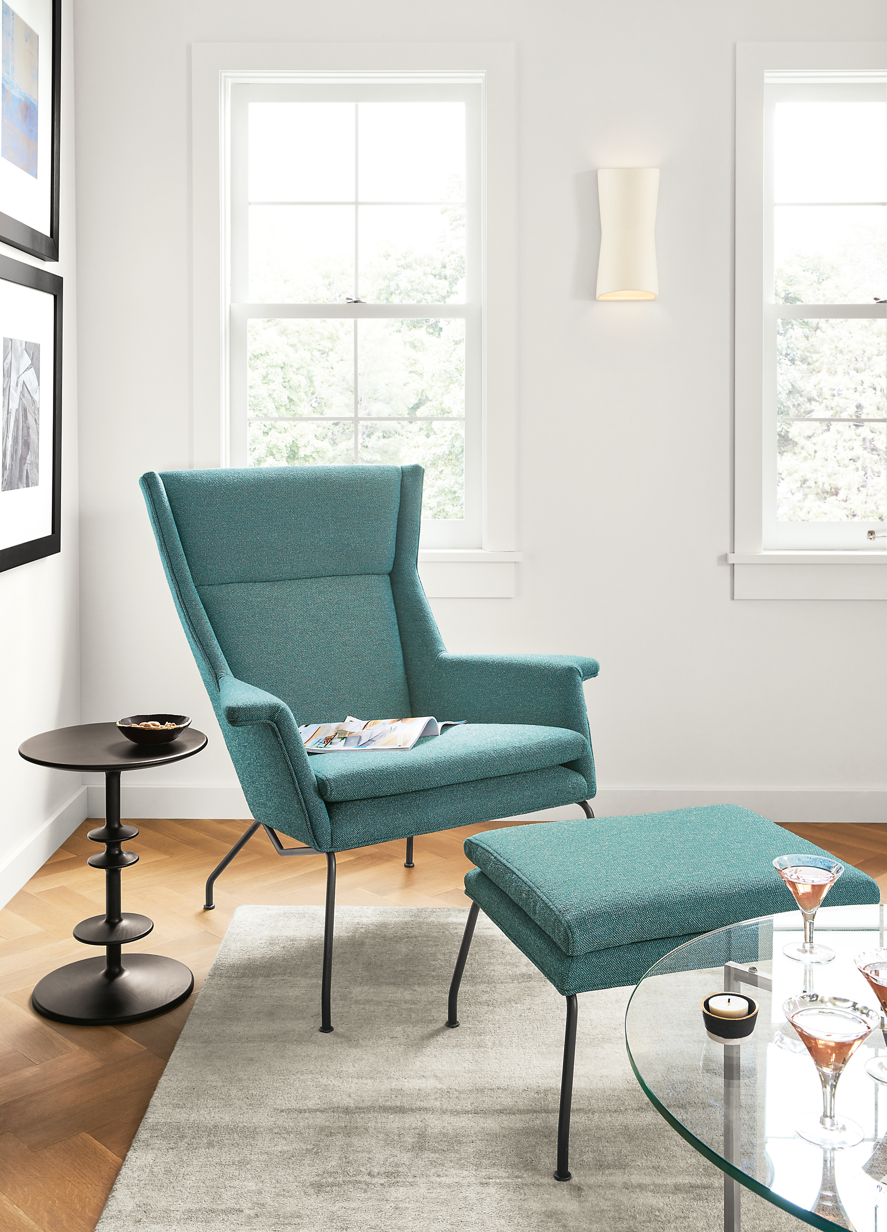 Detail of Aidan chair in Tatum teal fabric with ottoman.
