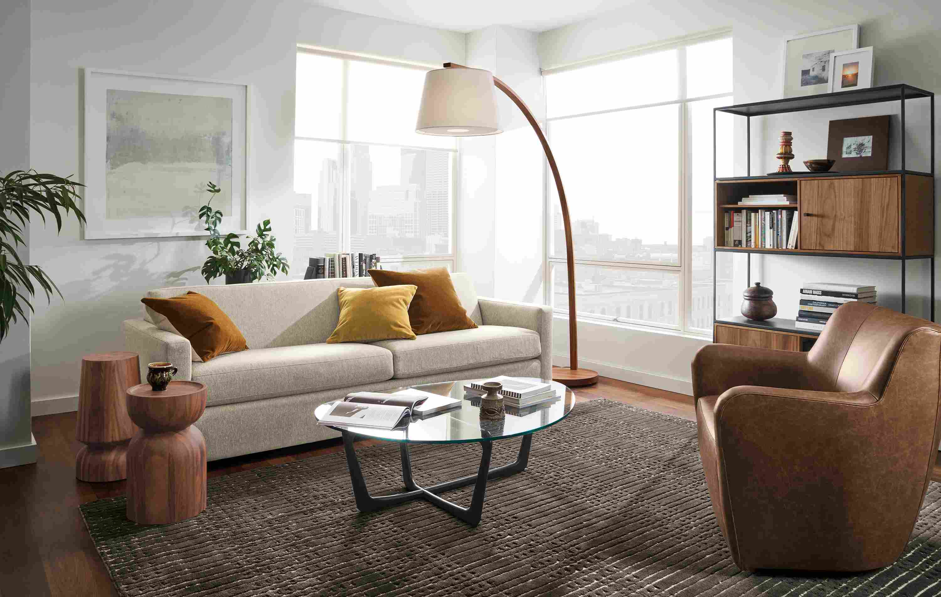 Living room with Alex sofa in Tepic Oatmeal, Lily swivel chair in Palermo Bourbon and Dunn coffee table.