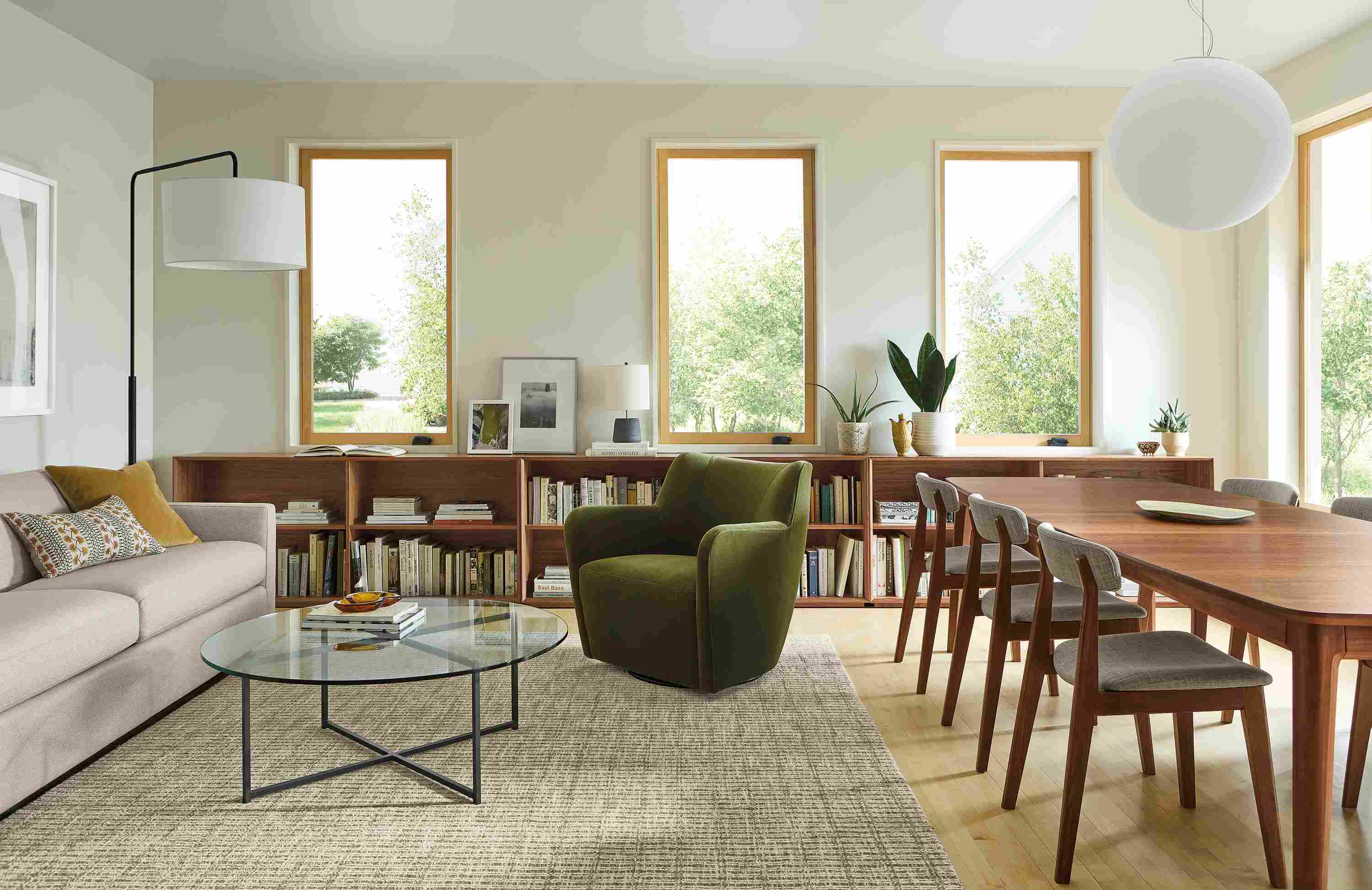 A great room with 94-wide Alex sofa in Derry Natural, Walcott extension table in walnut and Nera rug in Stone.