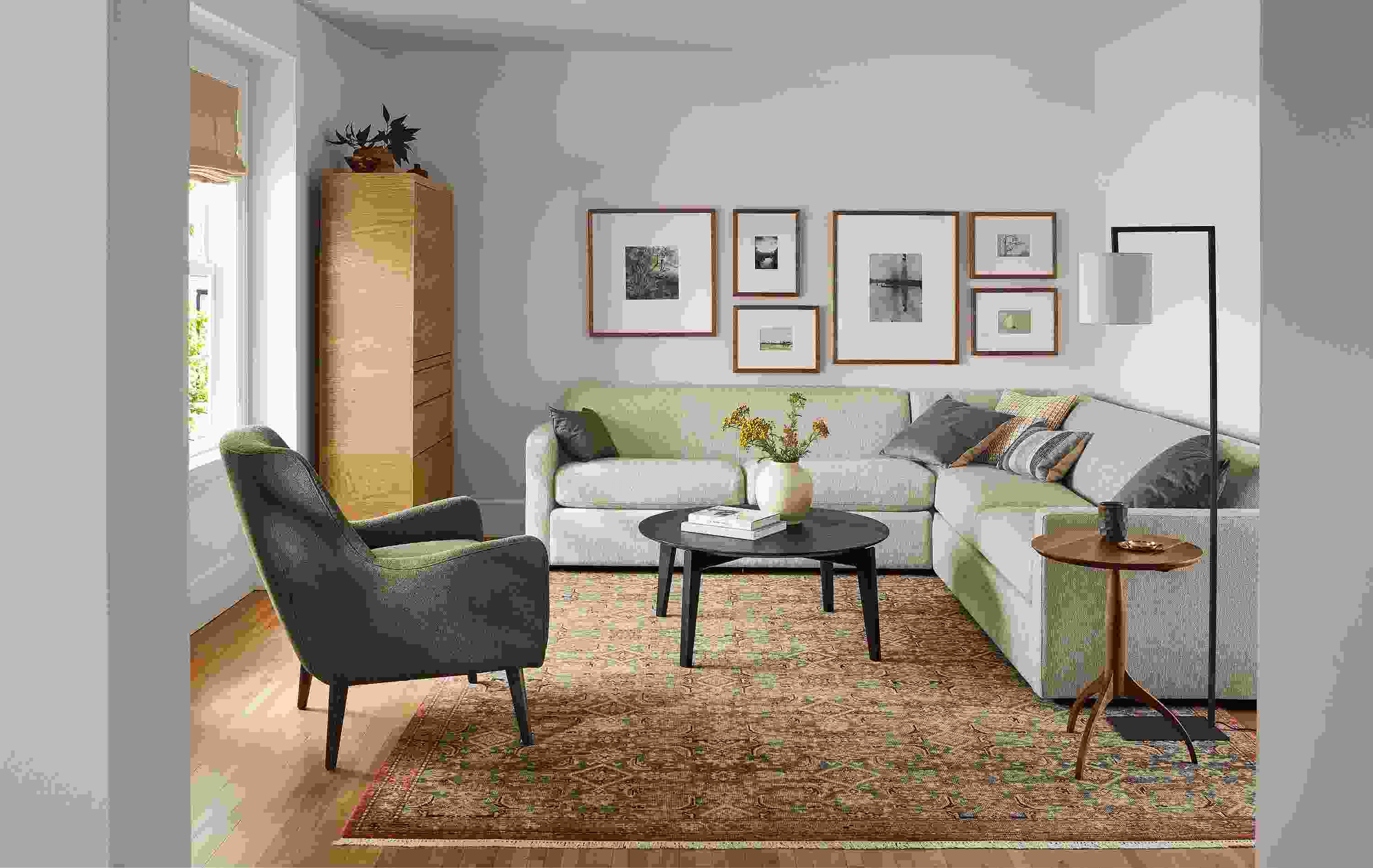 Living room with Alex sectional in Tepic Oatmeal, Orlin coffee table in charcoal and Quinn chair in Declan Olive.