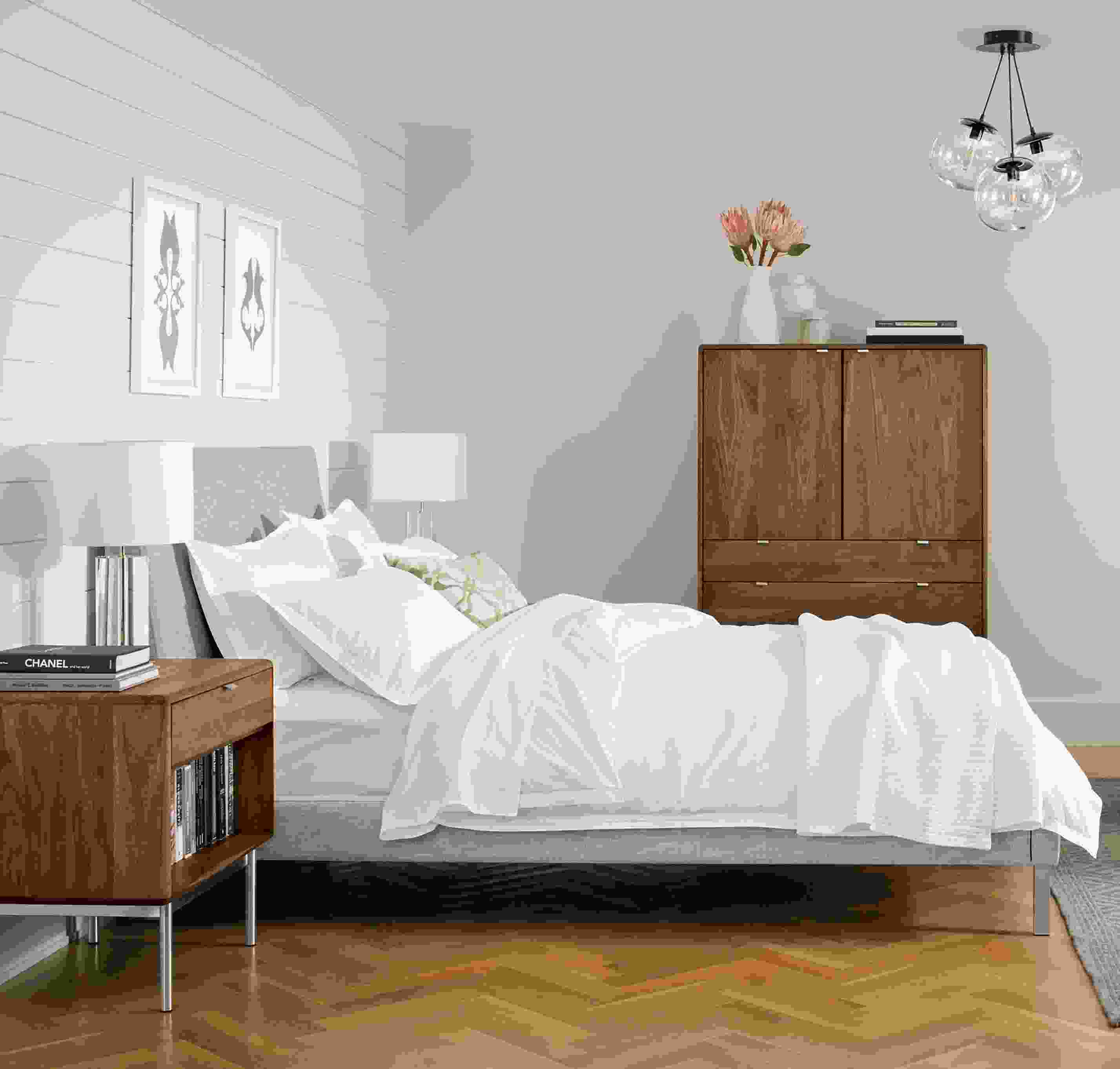 Bedroom with Ella Queen Bed in Destin Grey and Hensley nightstand and armoire in walnut.
