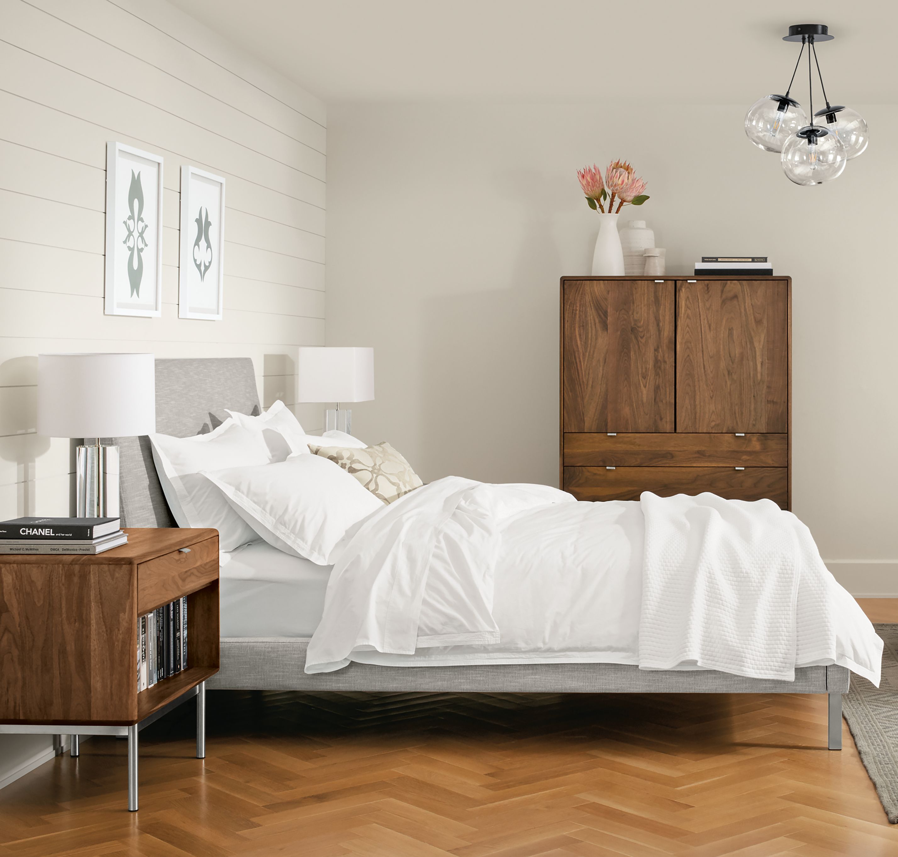 Bedroom with Ella Queen Bed in Destin Grey and Hensley nightstand and armoire in walnut.