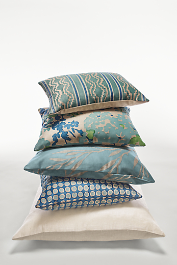 Stack of Allende throw pillows in blue and white.