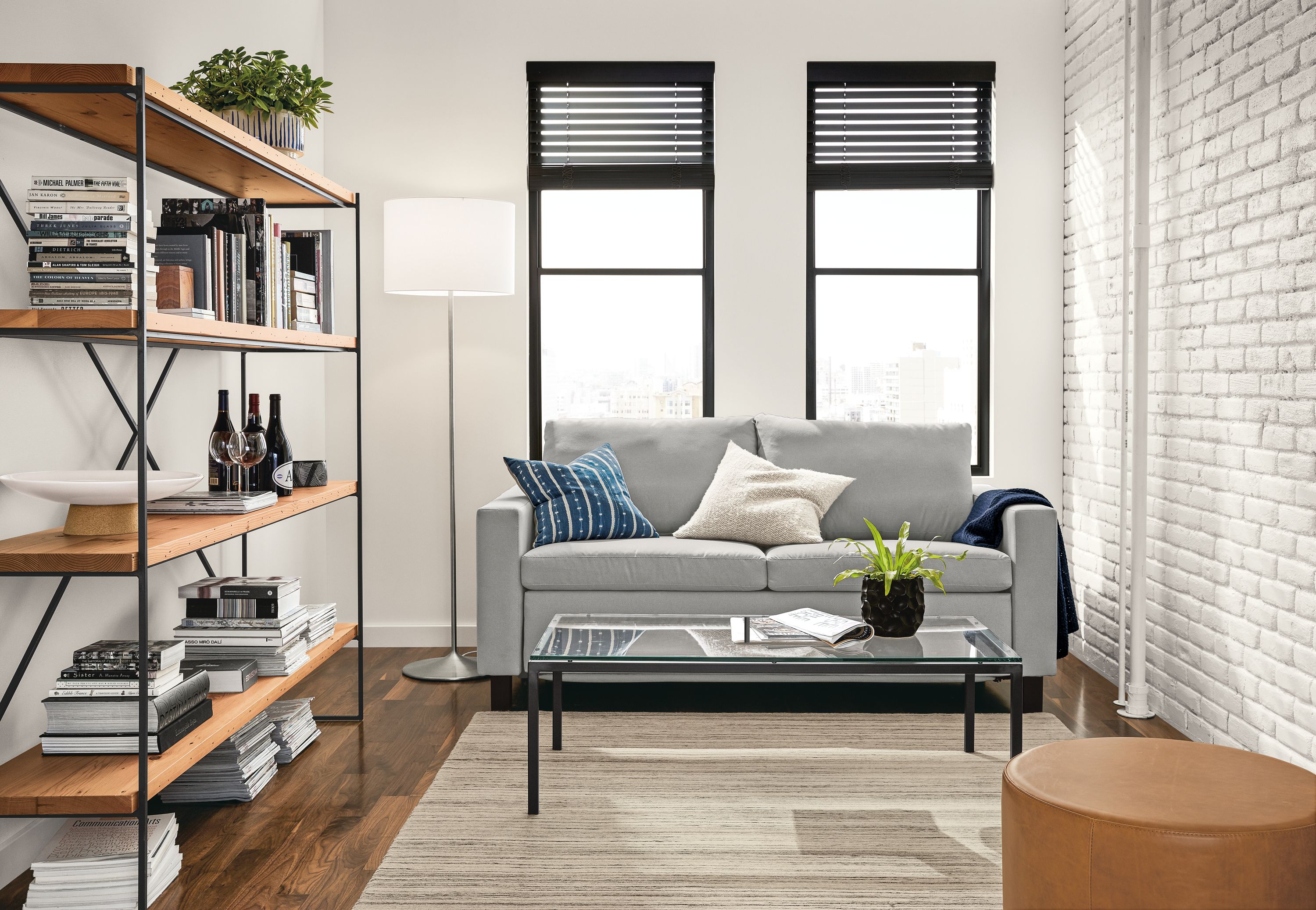 Apartment living room with Allston queen sleeper sofa in Dawson Grey and Nomad rug in Ivory/grey.
