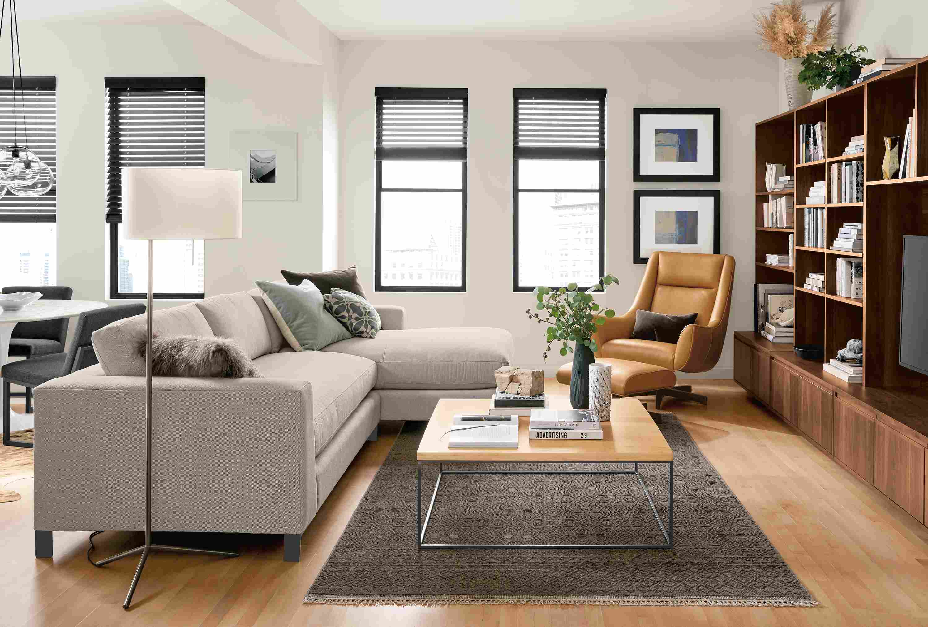 Great room with Altura 114-wide sofa with right-arm chaise in Sole grey and Anu rug in slate.
