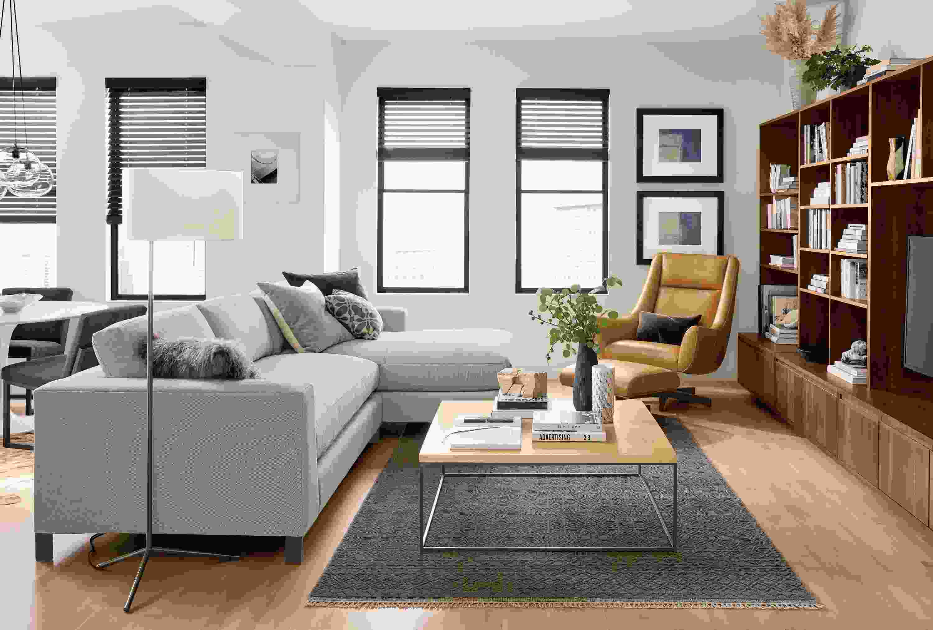 Great room with Altura 114-wide sofa with right-arm chaise in Sole grey and Anu rug in slate.
