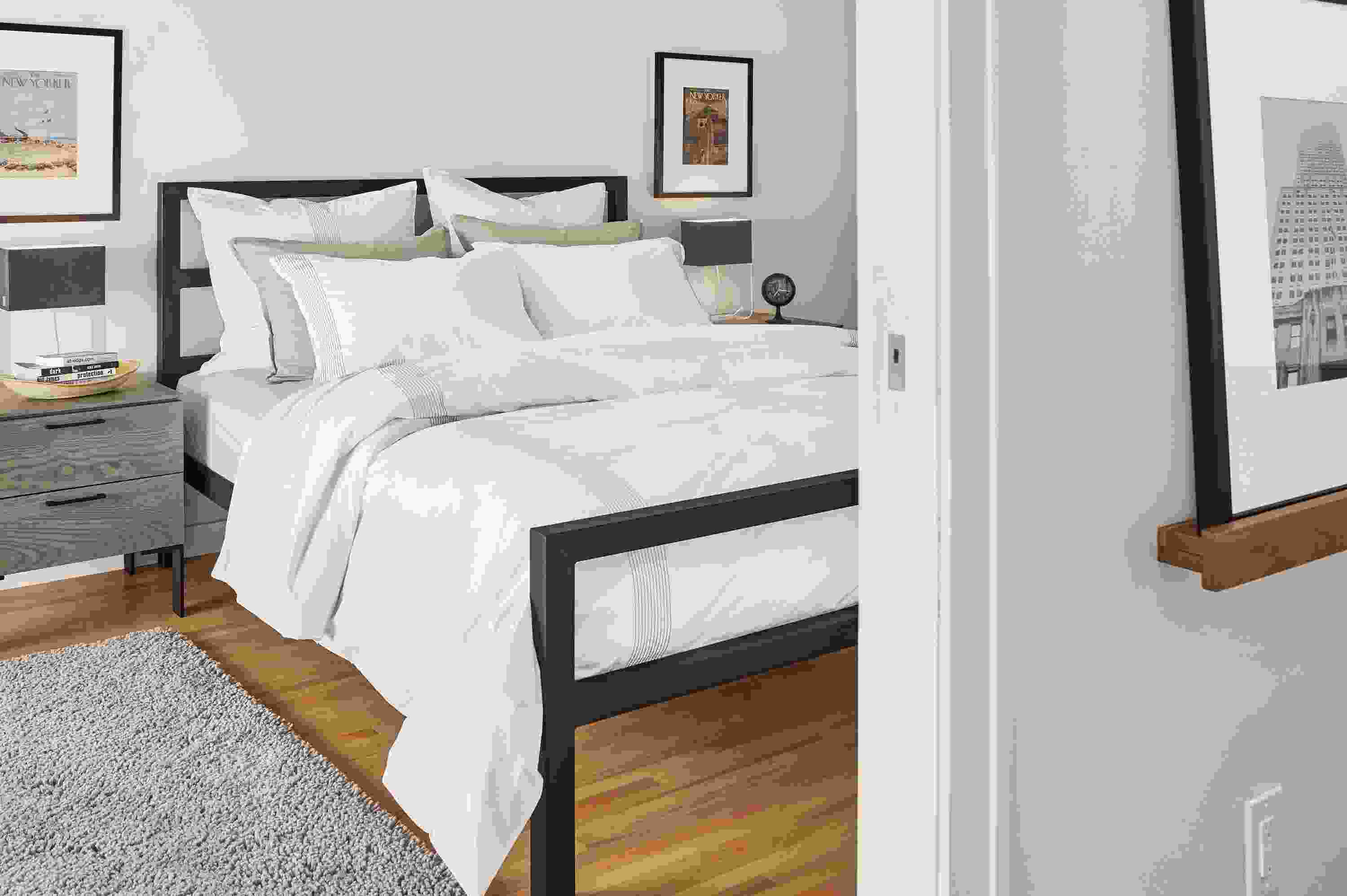 Cozy bedroom with Ambler duvet cover and percale shams in white on a Parsons Queen bed.