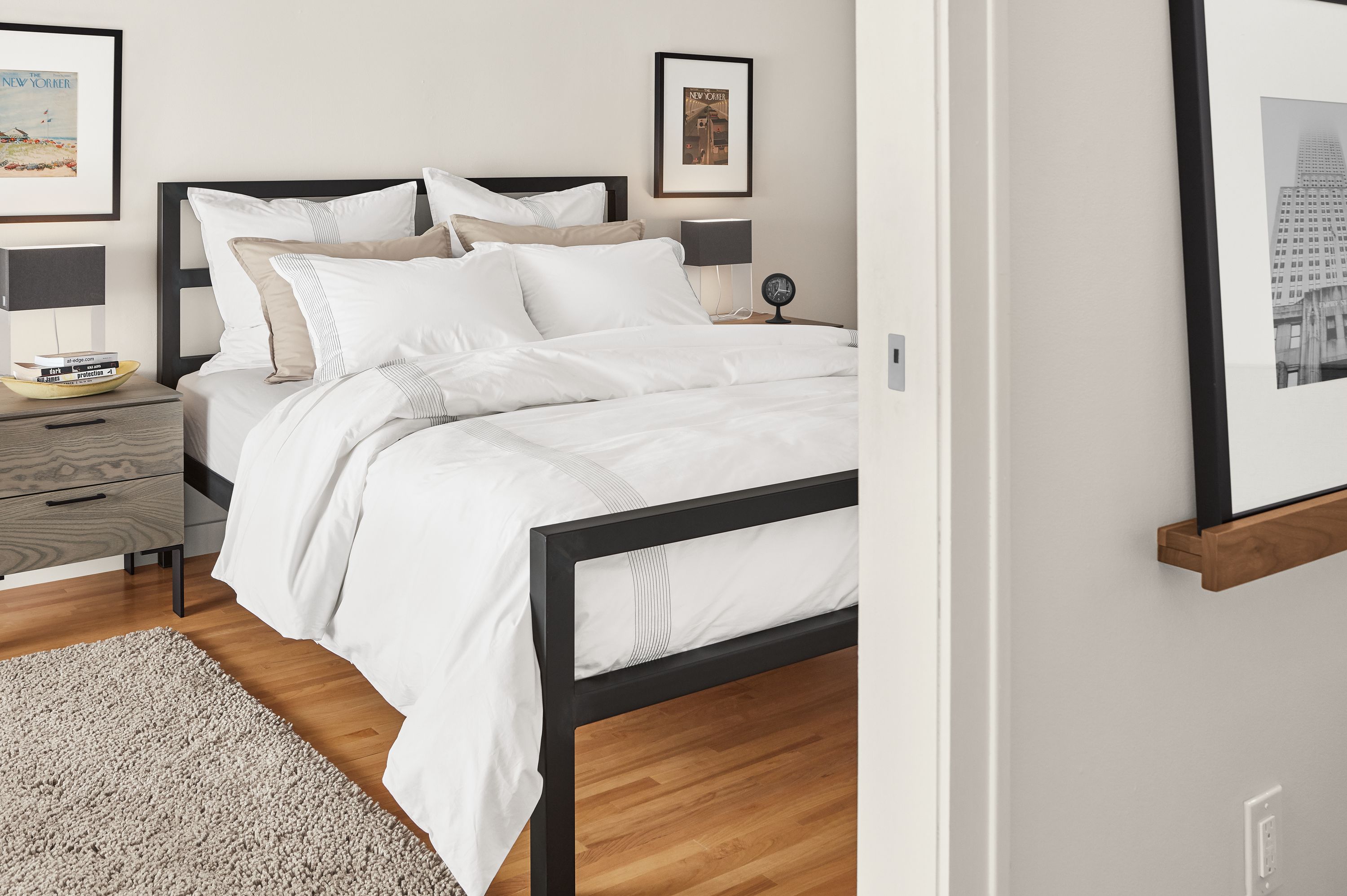 Cozy bedroom with Ambler duvet cover and percale shams in white on a Parsons Queen bed.