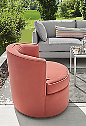 Detail of Ambrose swivel chair in Tristan Coral on patio.
