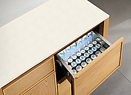 detail of corner of Amherst 48-wide refrigerated storage cabinet with top drawer open.