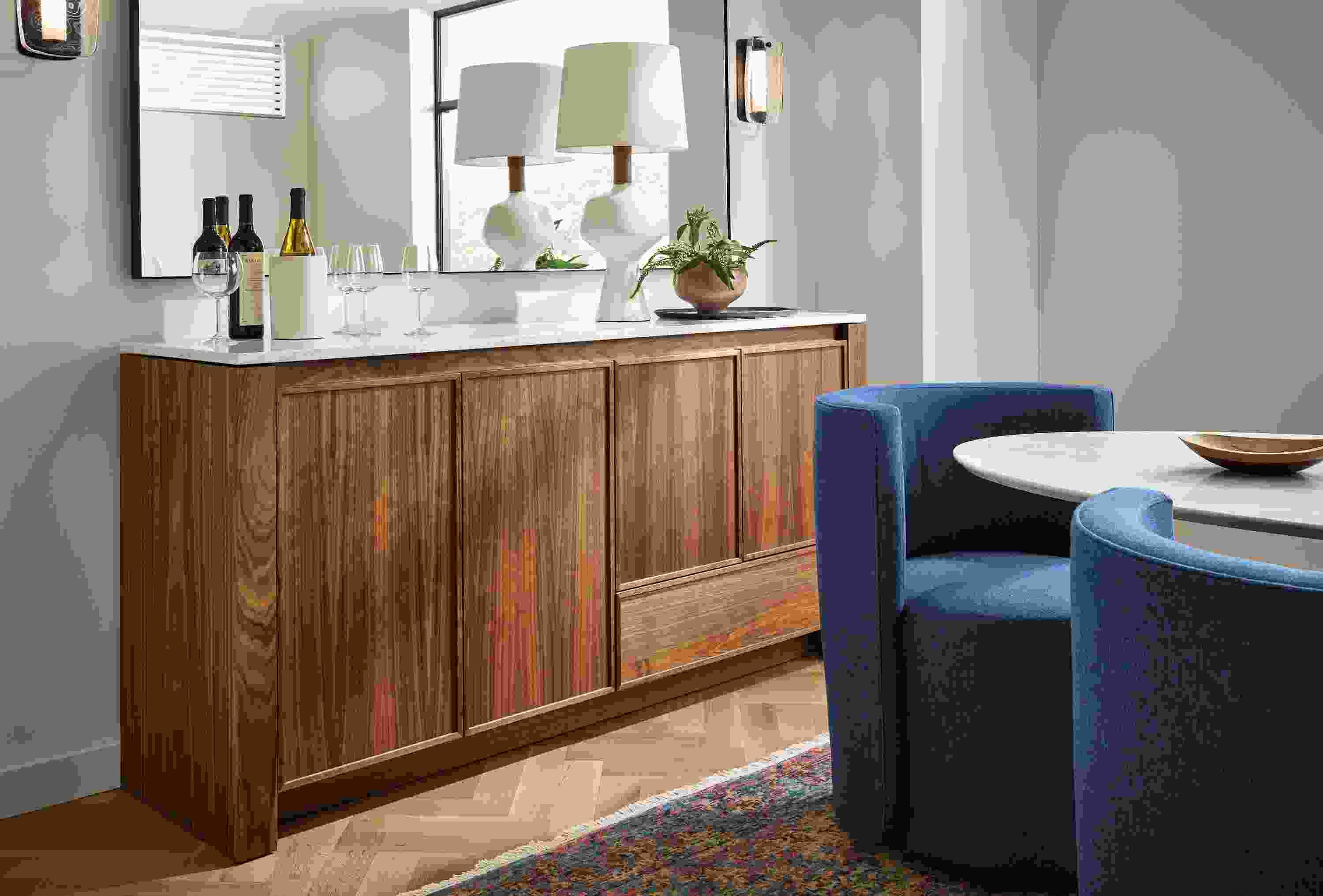 Dining room with Amherst 72-wide Storage Cabinet in walnut with Infinity 70-wide mirror in graphite.